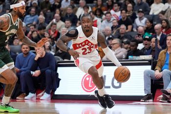 Nov 4, 2025; Toronto, Ontario, CAN; Toronto Raptors guard Jamal Shead (23) drives tot he net against Milwaukee Bucks guard Gary Trent Jr. (5) during the second half at Scotiabank Arena. Mandatory Credit: John E. Sokolowski-Imagn Images