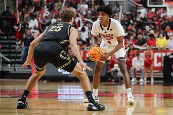 Nov 4, 2025; Lubbock, Texas, USA; Texas Tech Red Raiders guard Christian Anderson (4) dribbles the ball against Lindenwood Lions forward Todd Bieg (25) in the second half at United Supermarkets Arena. Mandatory Credit: Michael C. Johnson-Imagn Images