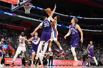 Nov 5, 2025; Detroit, Michigan, USA; Detroit Pistons guard Cade Cunningham (2) shoots the ball over Utah Jazz center Jusuf Nurkic (30)  in the fourth quarter at Little Caesars Arena. Mandatory Credit: Lon Horwedel-Imagn Images