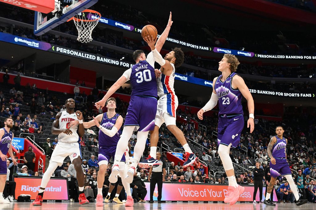 Nov 5, 2025; Detroit, Michigan, USA; Detroit Pistons guard Cade Cunningham (2) shoots the ball over Utah Jazz center Jusuf Nurkic (30) in the fourth quarter at Little Caesars Arena. Mandatory Credit: Lon Horwedel-Imagn Images