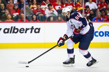 Nov 5, 2025; Calgary, Alberta, CAN; Columbus Blue Jackets right wing Kirill Marchenko (86) skates with the puck against the Calgary Flames during the first period at Scotiabank Saddledome. Mandatory Credit: Sergei Belski-Imagn Images