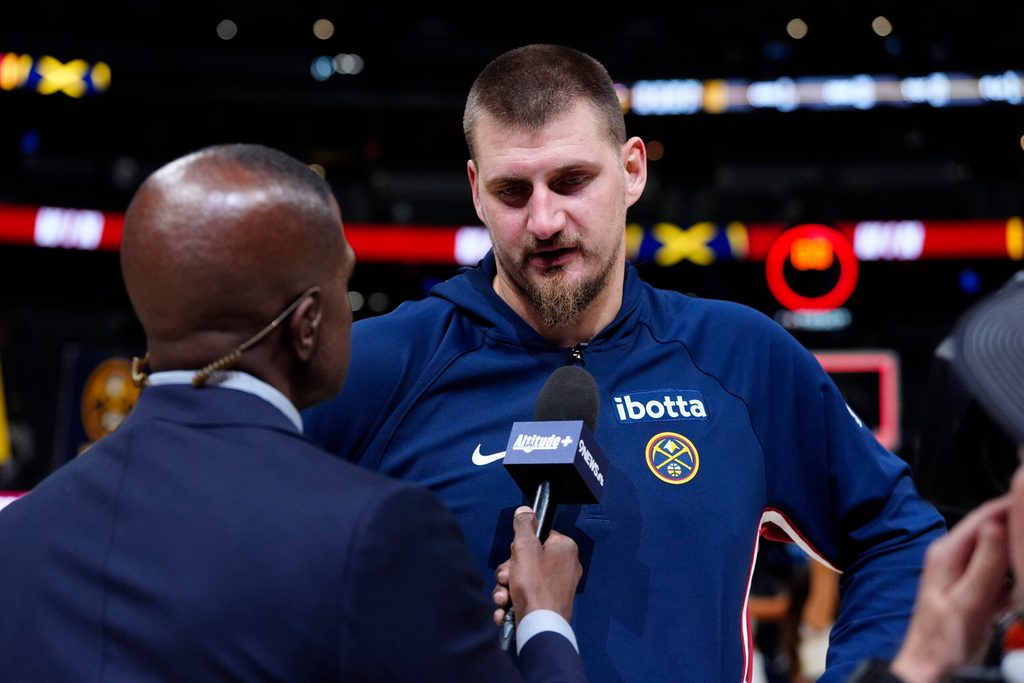 Nov 5, 2025; Denver, Colorado, USA; Denver Nuggets center Nikola Jokic (15) is interviewed following the win against the Miami Heat in the second half at Ball Arena. Mandatory Credit: Ron Chenoy-Imagn Images