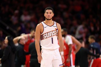 Nov 6, 2025; Phoenix, Arizona, USA; Phoenix Suns guard Devin Booker (1) against the Los Angeles Clippers in the second half at the Mortgage Matchup Center. Mandatory Credit: Mark J. Rebilas-Imagn Images