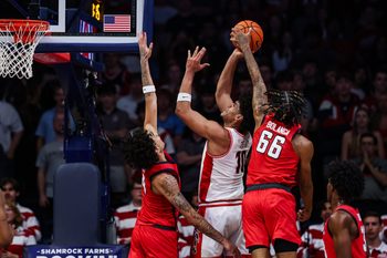 Nov 7, 2025; Tucson, Arizona, USA; Utah Tech Trailblazers guard Noah Bolanga (66) blocks a basket attempted by Arizona Wildcats forward Koa Peat (10) during the first half of the game at McKale Memorial Center. Mandatory Credit: Aryanna Frank-Imagn Images