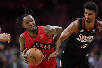Nov 8, 2025; Philadelphia, Pennsylvania, USA; Toronto Raptors guard Immanuel Quickley (5) drives against Philadelphia 76ers guard Quentin Grimes (5) during the fourth quarter at Xfinity Mobile Arena. Mandatory Credit: Bill Streicher-Imagn Images
