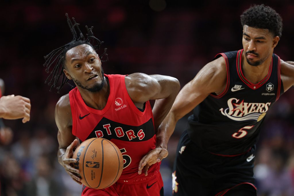 Nov 8, 2025; Philadelphia, Pennsylvania, USA; Toronto Raptors guard Immanuel Quickley (5) drives against Philadelphia 76ers guard Quentin Grimes (5) during the fourth quarter at Xfinity Mobile Arena. Mandatory Credit: Bill Streicher-Imagn Images