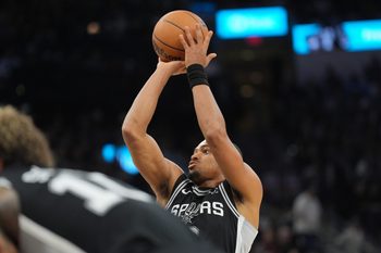 Nov 8, 2025; San Antonio, Texas, USA;  San Antonio Spurs forward Keldon Johnson (3) shoots a free throw in the second half against the New Orleans Pelicans at Frost Bank Center. Mandatory Credit: Daniel Dunn-Imagn Images