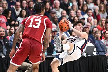 Nov 8, 2025; Spokane, Washington, USA; Gonzaga Bulldogs guard Mario Saint-Supery (17) is fouled on the drive by Oklahoma Sooners forward Tae Davis (13) in the second half at Numerica Veterans Arena. Gonzaga Bulldogs won 83-68. Mandatory Credit: James Snook-Imagn Images