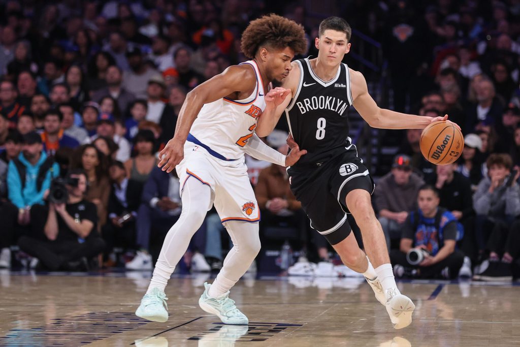 Nov 9, 2025; New York, New York, USA; Brooklyn Nets guard Egor Demin (8) looks to drive past New York Knicks guard Miles McBride (2) in the fourth quarter at Madison Square Garden. Mandatory Credit: Wendell Cruz-Imagn Images
