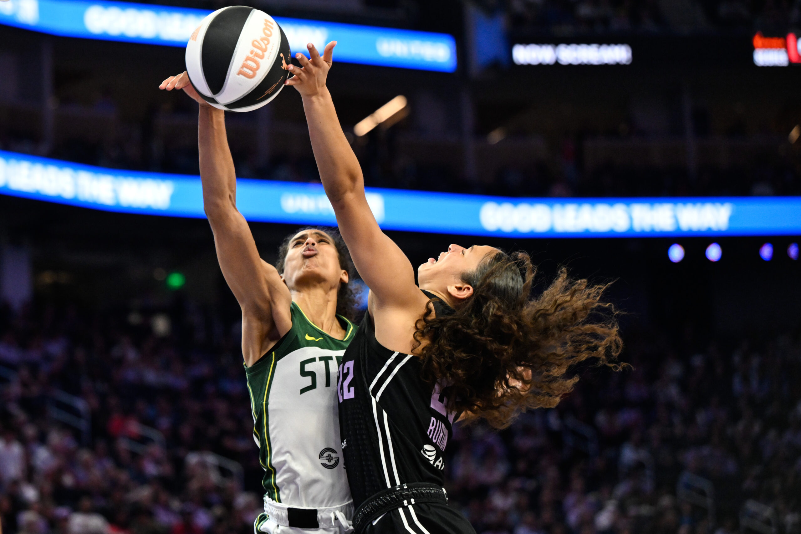 Jun 14, 2025; San Francisco, California, USA; Seattle Storm guard Skylar Diggins (4) blocks a layup attempt by Golden State Valkyries guard Veronica Burton (22) in the second quarter at Chase Center. Mandatory Credit: Eakin Howard-Imagn Images