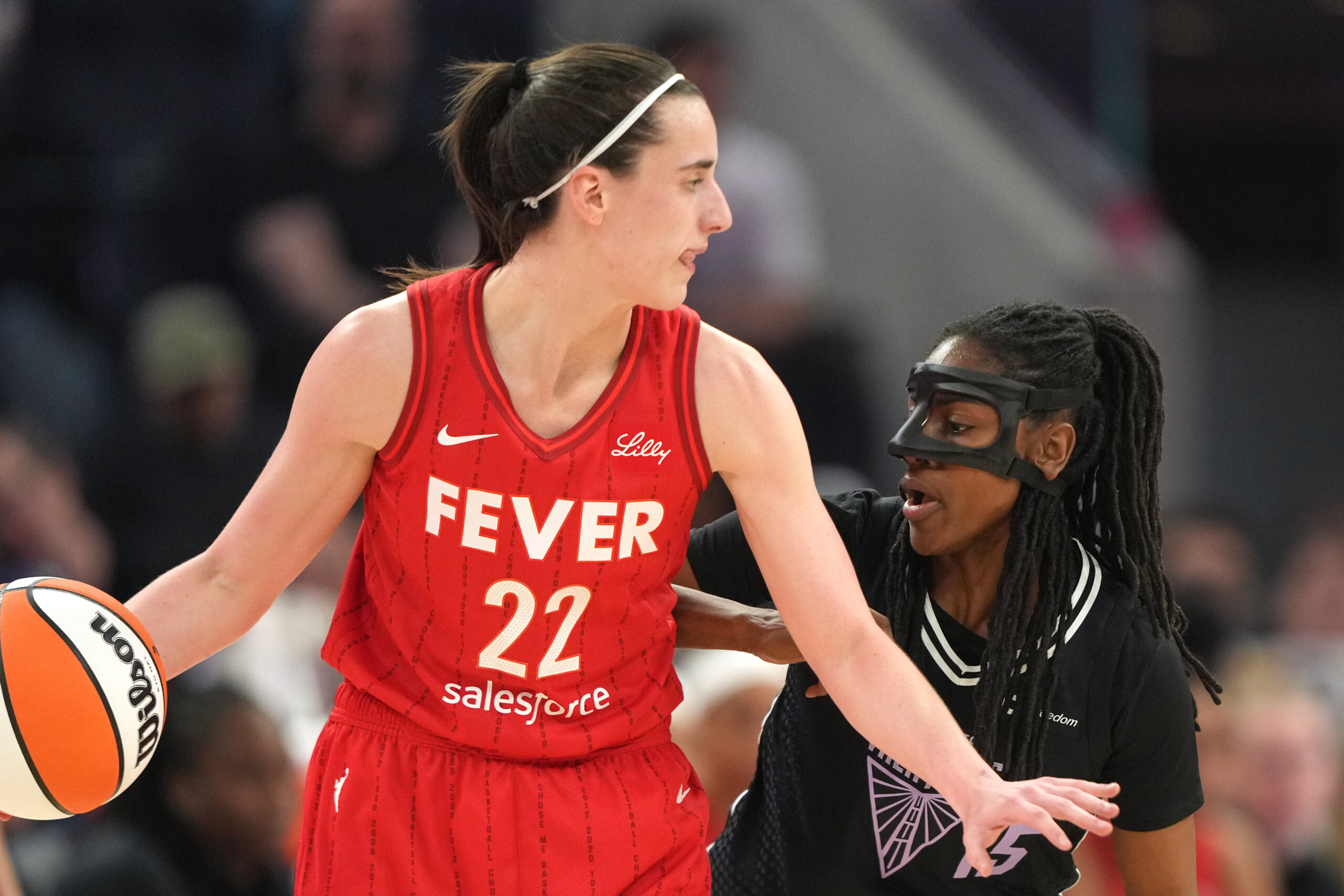 Jun 19, 2025; San Francisco, California, USA; Golden State Valkyries guard Tiffany Hayes (right) defends against Indiana Fever guard Caitlin Clark (22) during the second quarter at Chase Center. Mandatory Credit: Darren Yamashita-Imagn Images