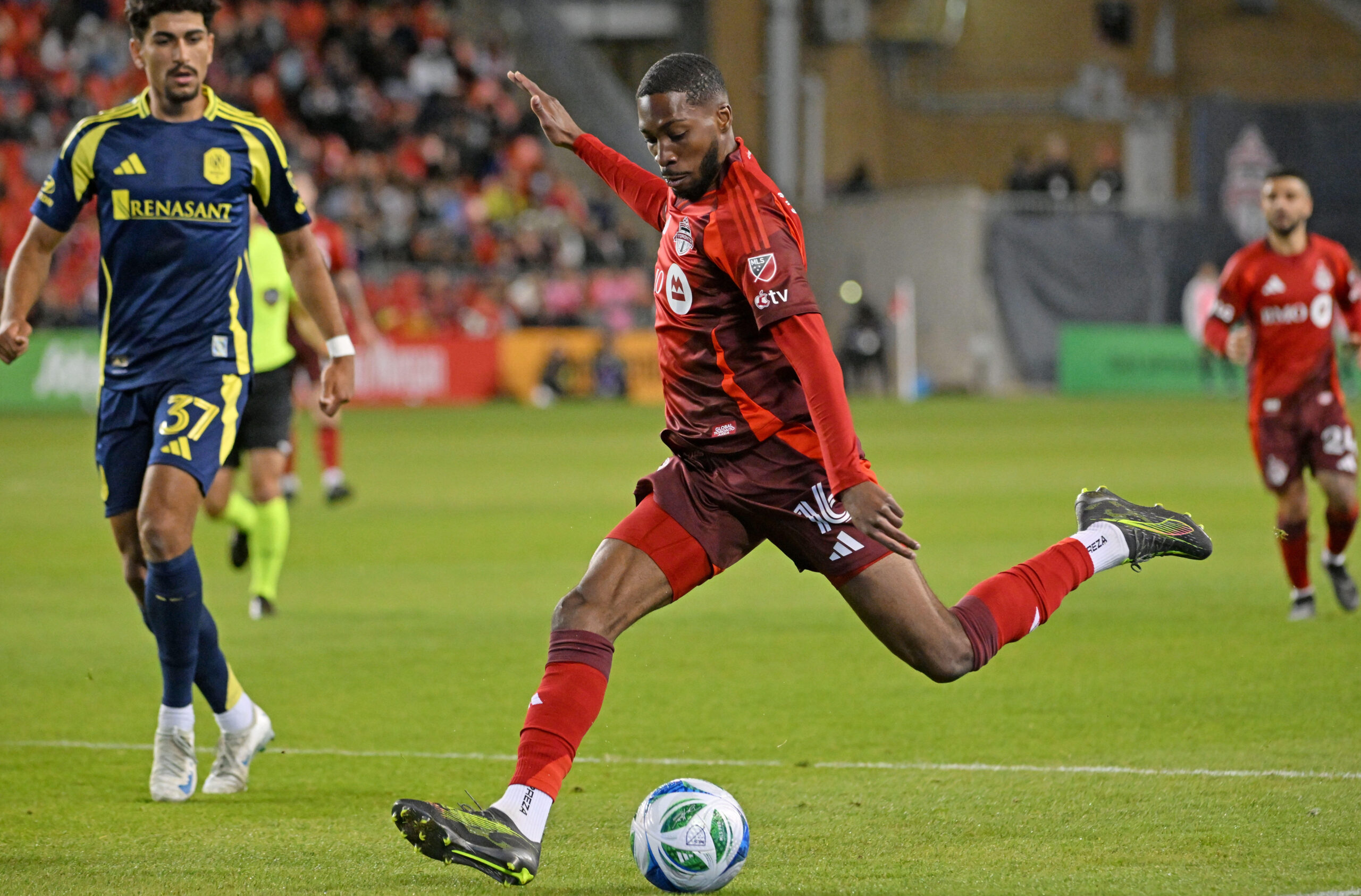 May 24, 2025; Toronto, Ontario, CAN;  Toronto FC forward Tyrese Spicer (16) shoots the ball against Nashville SC in the second half at BMO Field. Mandatory Credit: Dan Hamilton-Imagn Images