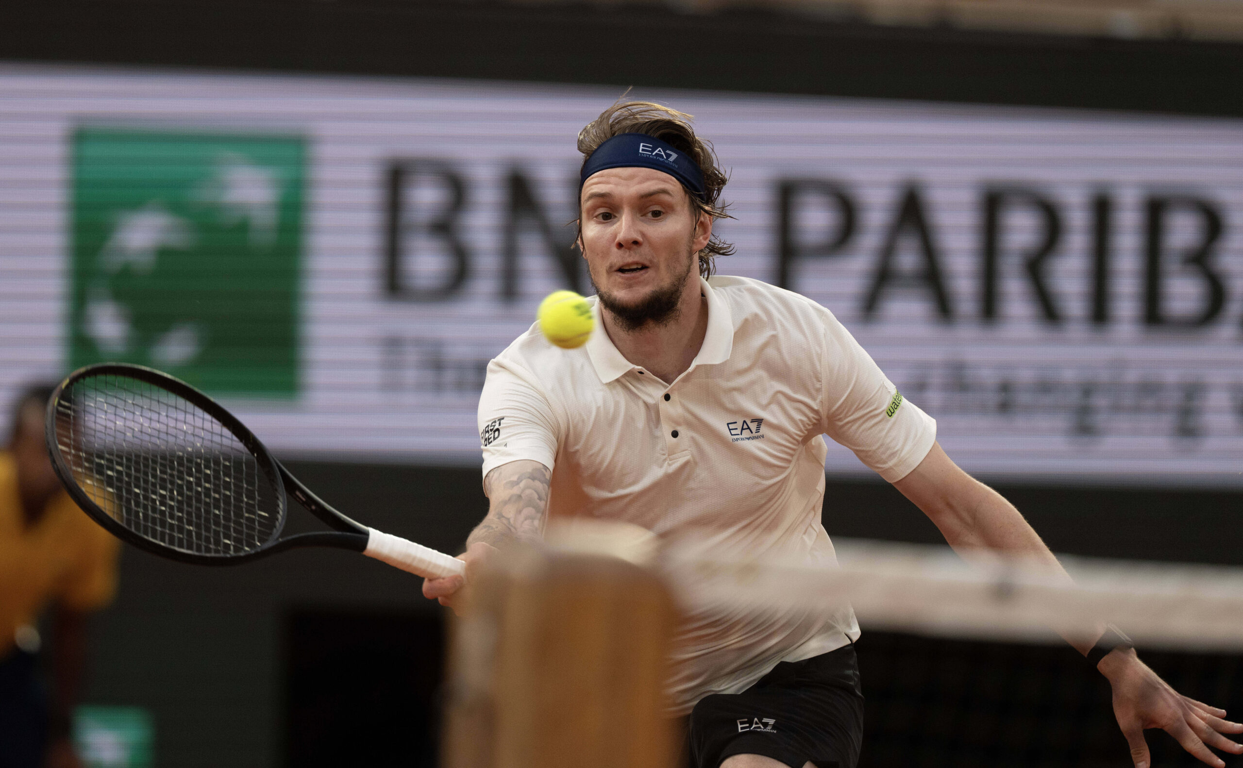 Jun 4, 2025; Paris, FR; Alexander Bublik of Kazakhstan returns a shot during his match against Jannik Sinner of Italy on day 11 at Roland Garros Stadium.  Mandatory Credit: Susan Mullane-Imagn Images
