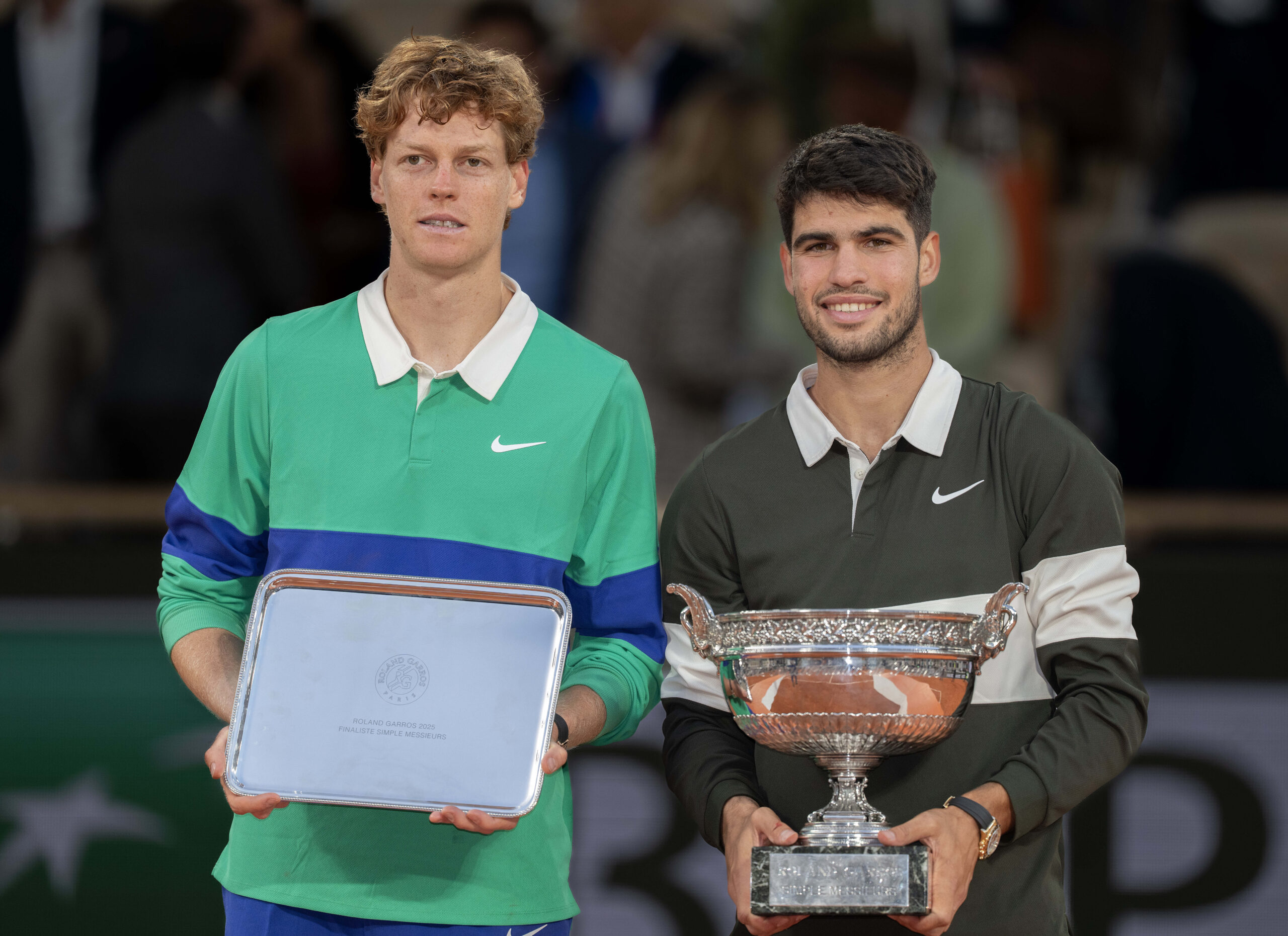 Jun 8, 2025; Paris, FR; Jannik Sinner of Italy and Carlos Alcaraz of Spain pose together at the trophy presentation after the men’s singles final on day 15 at Roland Garros Stadium. Mandatory Credit: Susan Mullane-Imagn Images