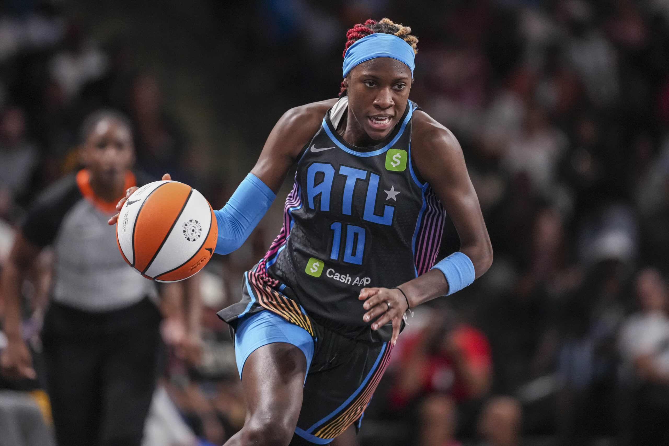 Jun 27, 2025; College Park, Georgia, USA; Atlanta Dream guard Rhyne Howard (10) brings the ball up the court against the Minnesota Lynx during the first half at Gateway Center Arena at College Park. Mandatory Credit: Dale Zanine-Imagn Images
