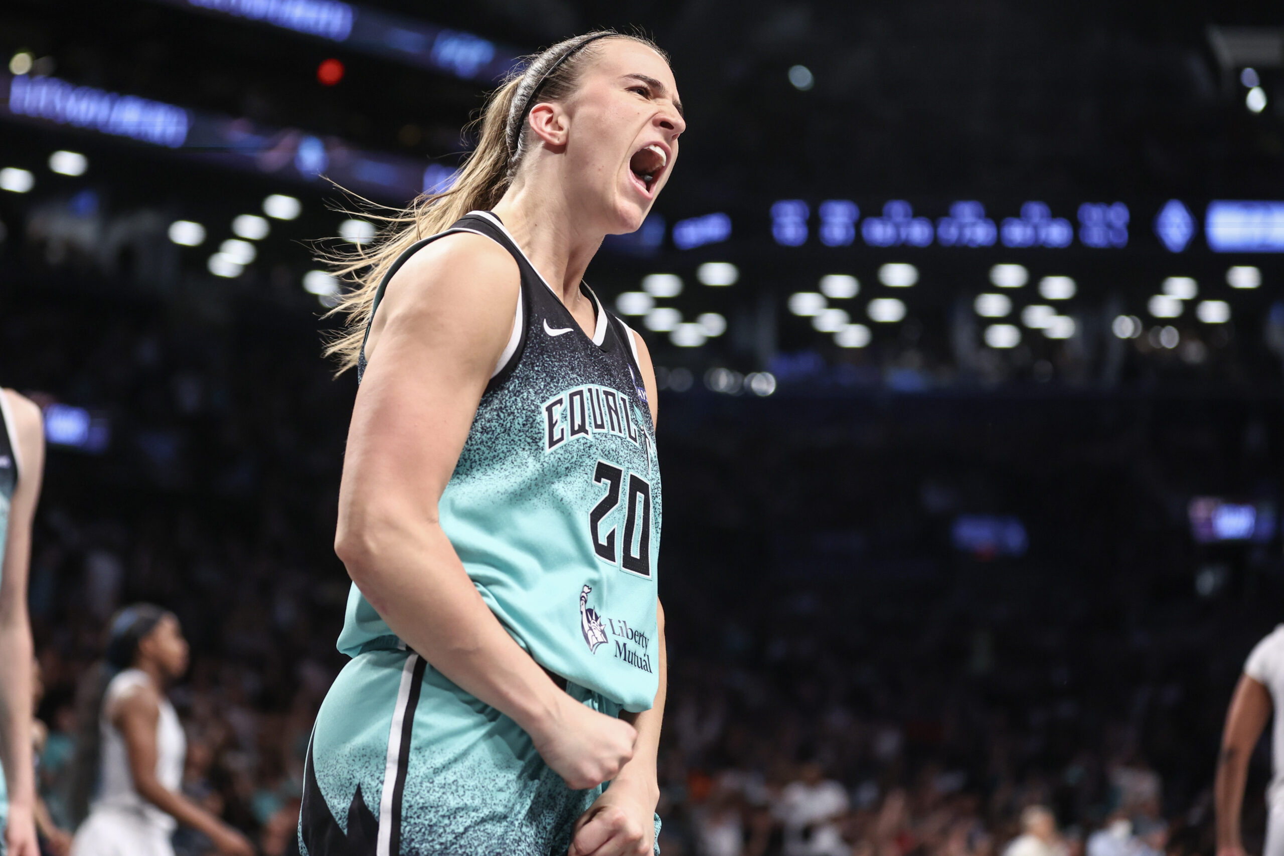 Jul 8, 2025; Brooklyn, New York, USA; New York Liberty guard Sabrina Ionescu (20) celebrates after scoring in the fourth quarter against the Las Vegas Aces at Barclays Center. Mandatory Credit: Wendell Cruz-Imagn Images