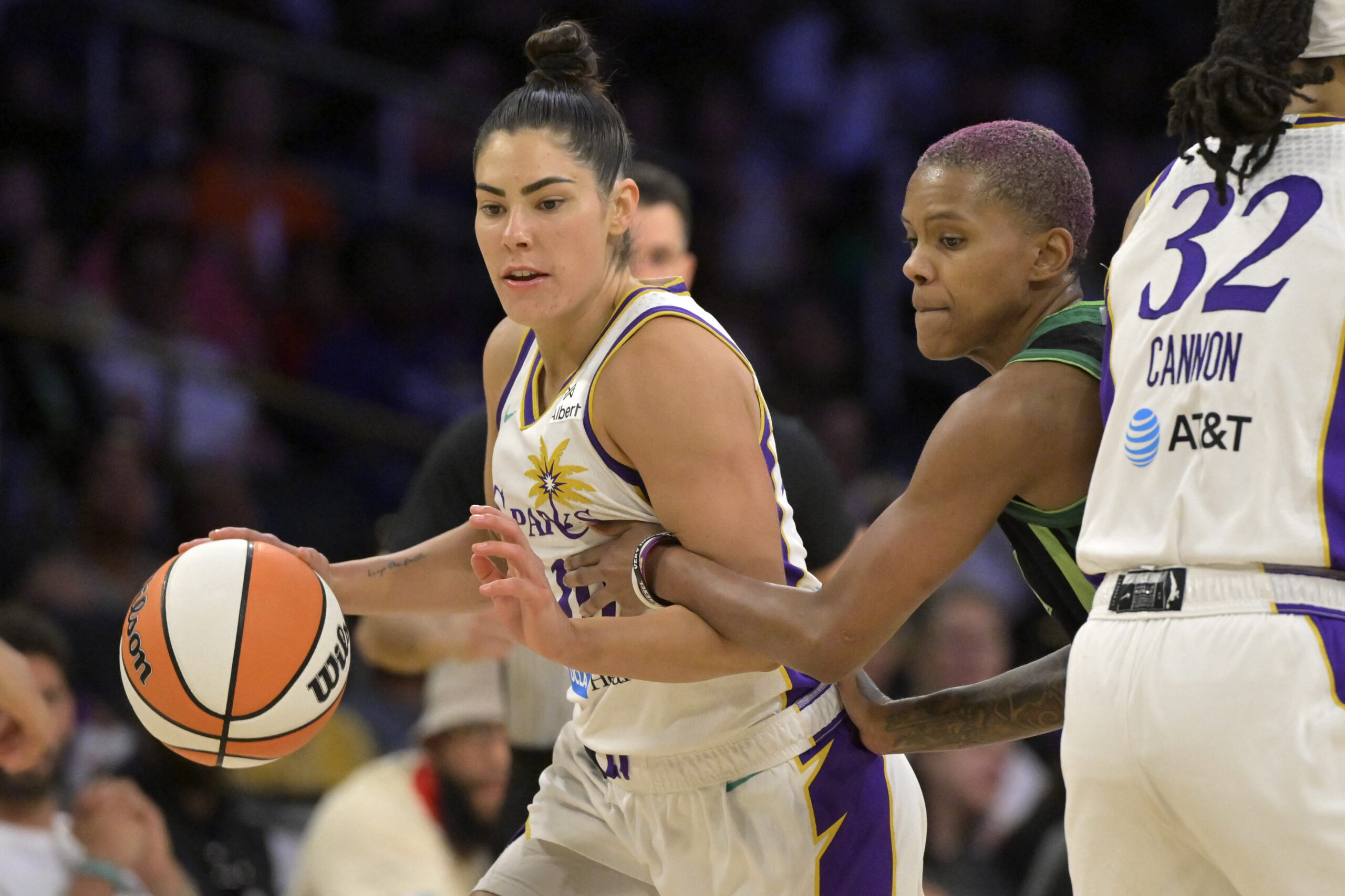 Jul 10, 2025; Los Angeles, California, USA; Los Angeles Sparks guard Kelsey Plum (10) drives past Minnesota Lynx guard Courtney Williams (10) in the second half at Crypto.com Arena. Mandatory Credit: Jayne Kamin-Oncea-Imagn Images
