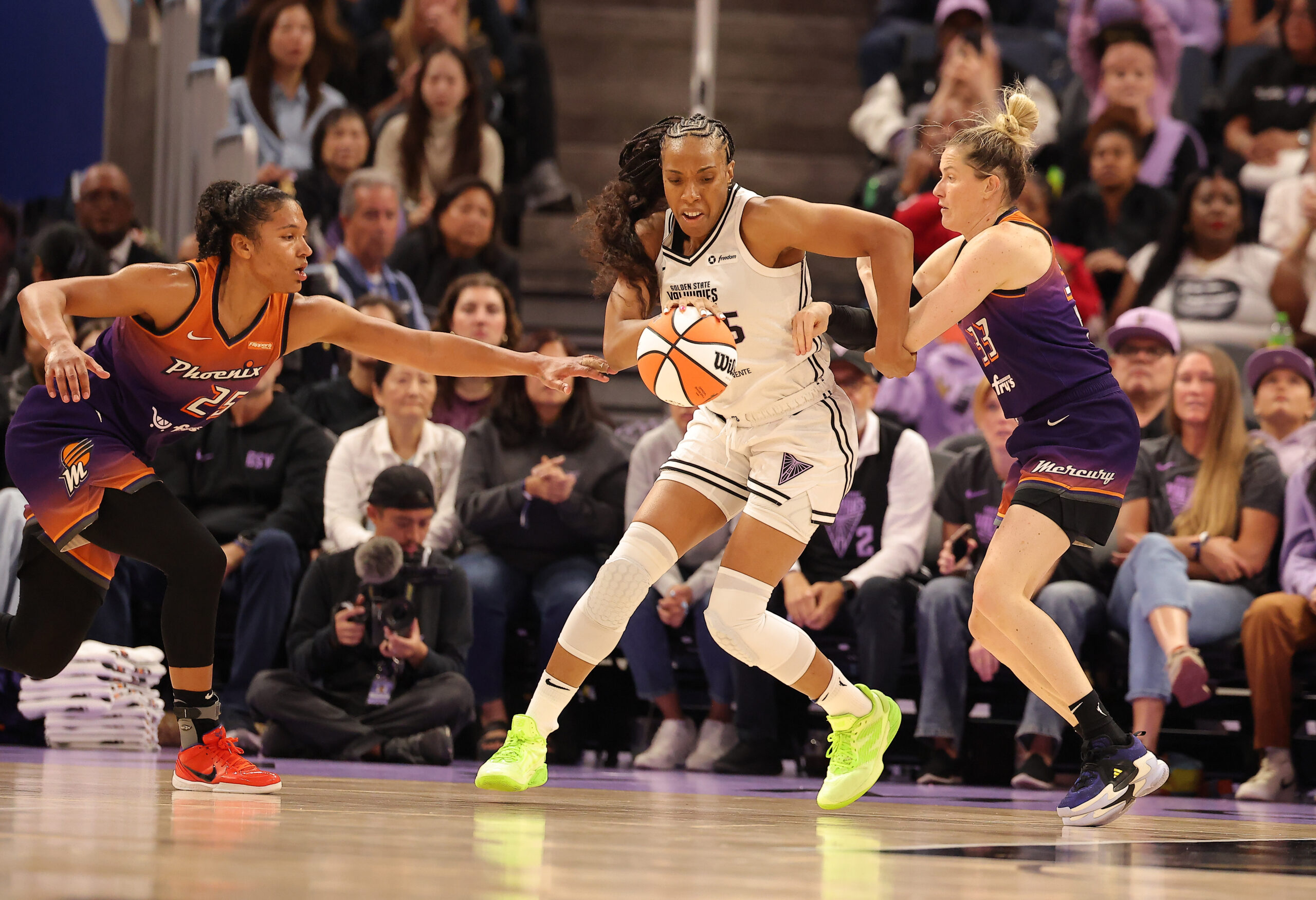 Jul 14, 2025; San Francisco, California, USA; Golden State Valkyries forward Kayla Thornton (5) controls the ball between Phoenix Mercury forward Alyssa Thomas (25) and Phoenix Mercury guard Sami Whitcomb (33) during the third quarter at Chase Center. Mandatory Credit: Kelley L Cox-Imagn Images