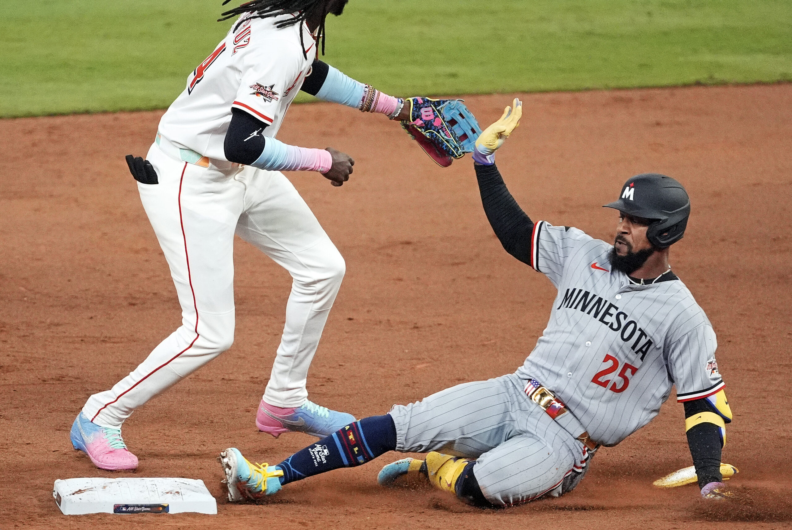 Jul 15, 2025; Cumberland, Georgia, USA; American League outfielder Byron Buxton (25) of the Minnesota Twins slides into second base after hitting a double during the ninth inning during the 2025 MLB All Star Game at Truist Park. Mandatory Credit: Dale Zanine-Imagn Images
