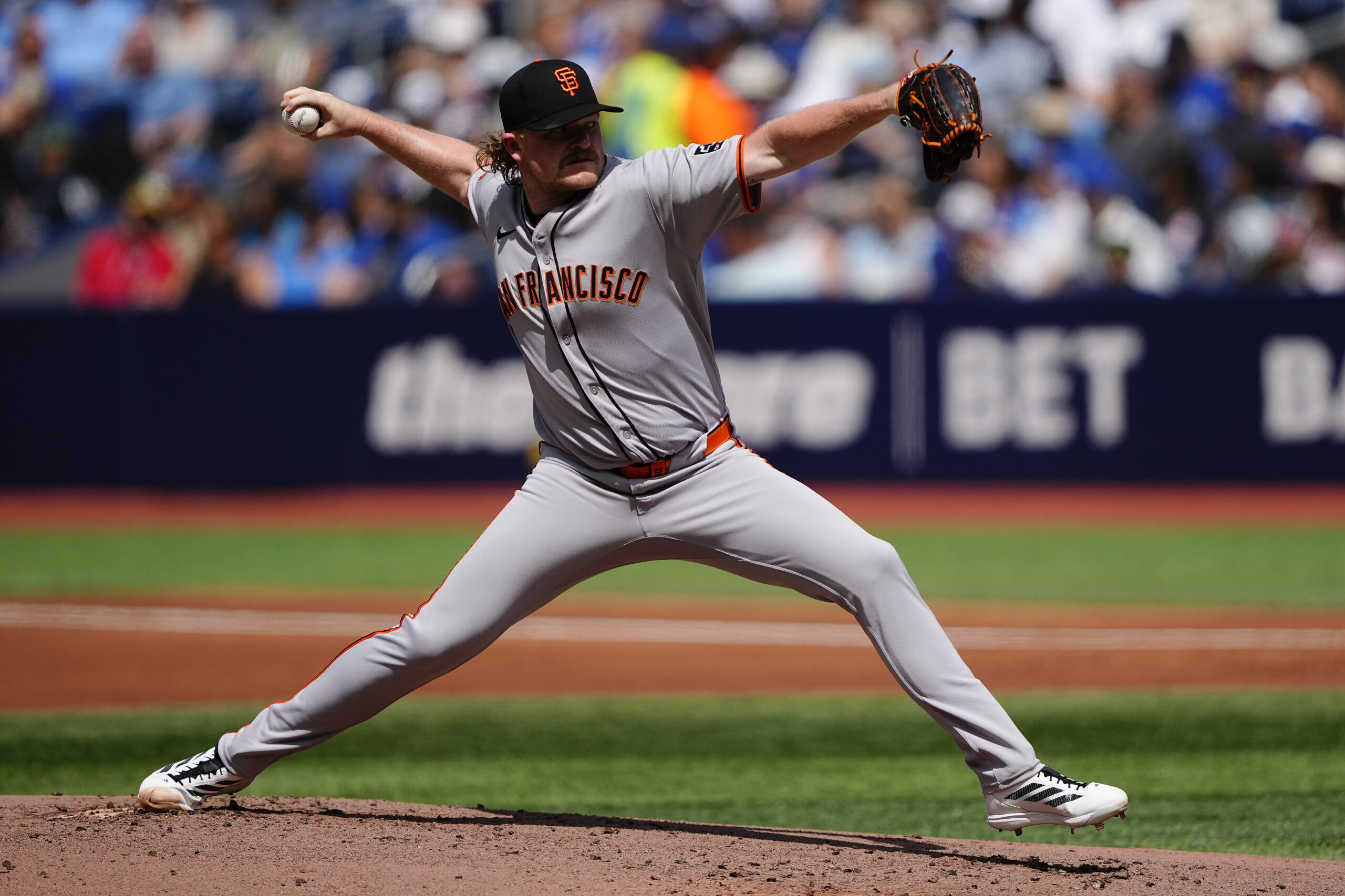 Jul 19, 2025; Toronto, Ontario, CAN; San Francisco Giants starting pitcher Logan Webb (62) pitches to the Toronto Blue Jays during the first inning at Rogers Centre. Mandatory Credit: John E. Sokolowski-Imagn Images