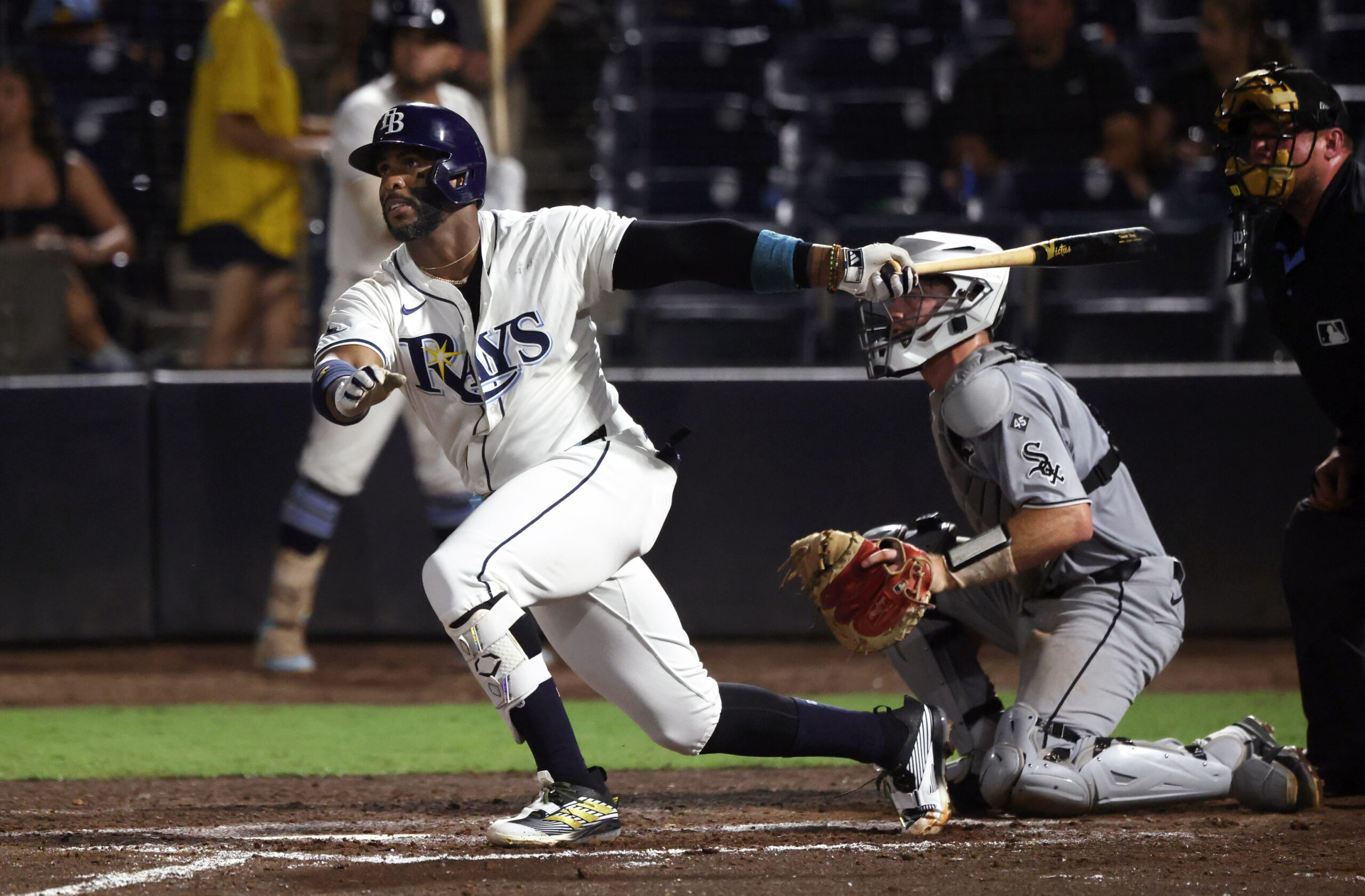 Jul 21, 2025; St. Petersburg, Florida, USA;  Tampa Bay Rays designated hitter Yandy Diaz (2) hits a home run during the seventh inning against the Chicago White Sox at George M. Steinbrenner Field. Mandatory Credit: Kim Klement Neitzel-Imagn Images