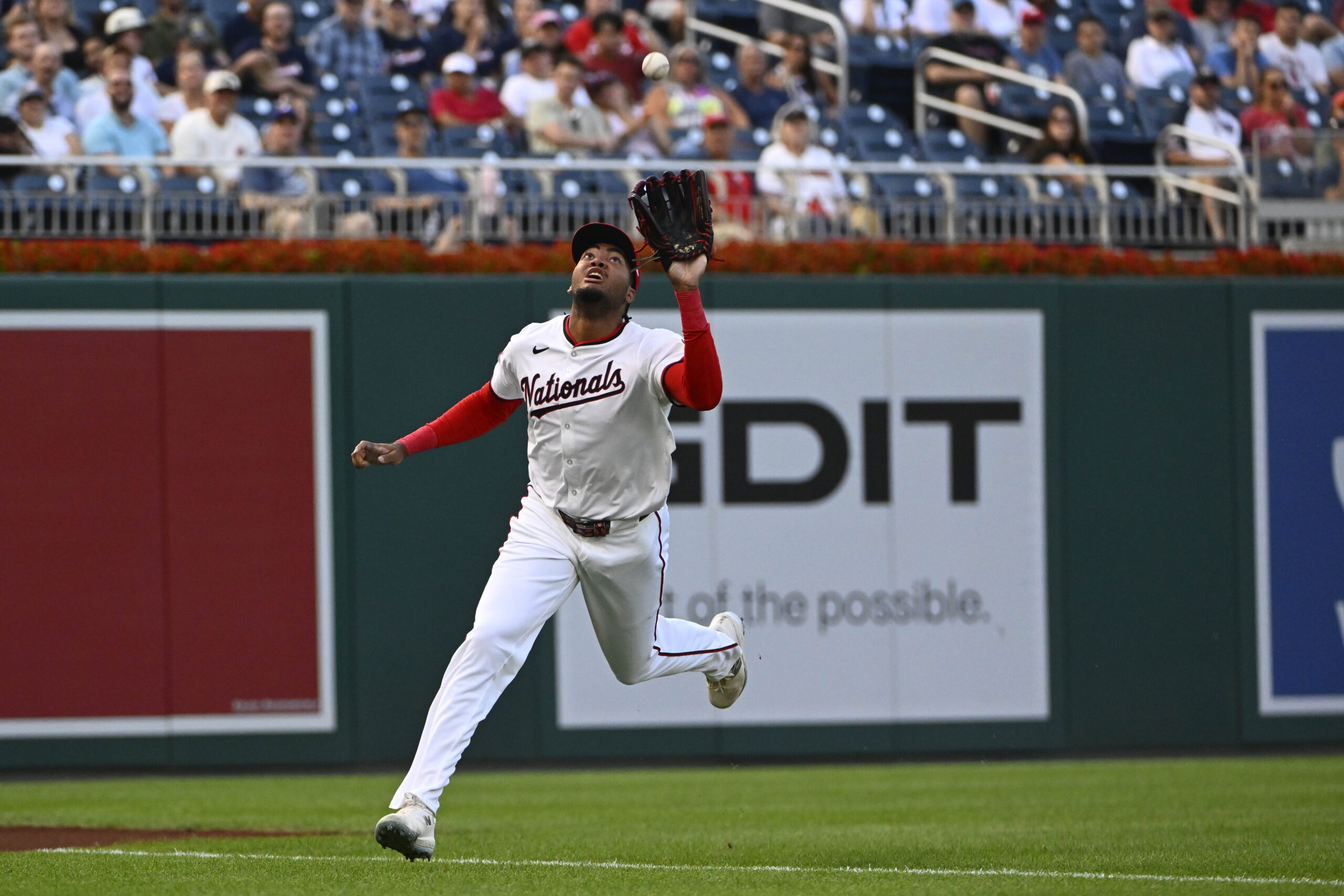 Jul 22, 2025; Washington, District of Columbia, USA; Washington Nationals left fielder James Wood (29) catches the fly ball hit by Cincinnati Reds right fielder Jake Fraley (27) to end the second inning at Nationals Park. Mandatory Credit: Brad Mills-Imagn Images