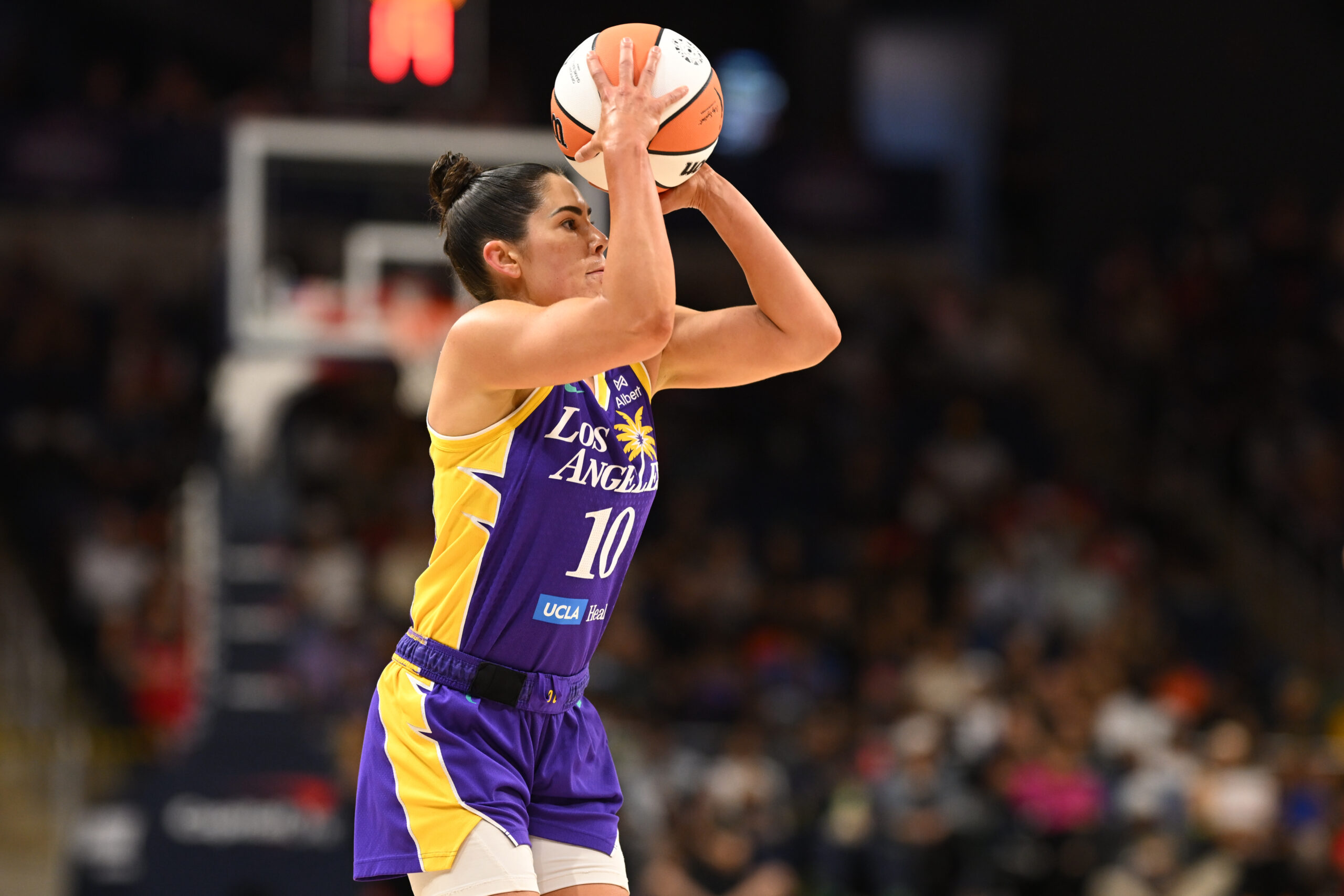 Jul 22, 2025; Washington, District of Columbia, USA;  Los Angeles Sparks guard Kelsey Plum (10) attempts a jump shot against the Washington Mystics during the first quarter at CareFirst Arena. Mandatory Credit: Rafael Suanes-Imagn Images