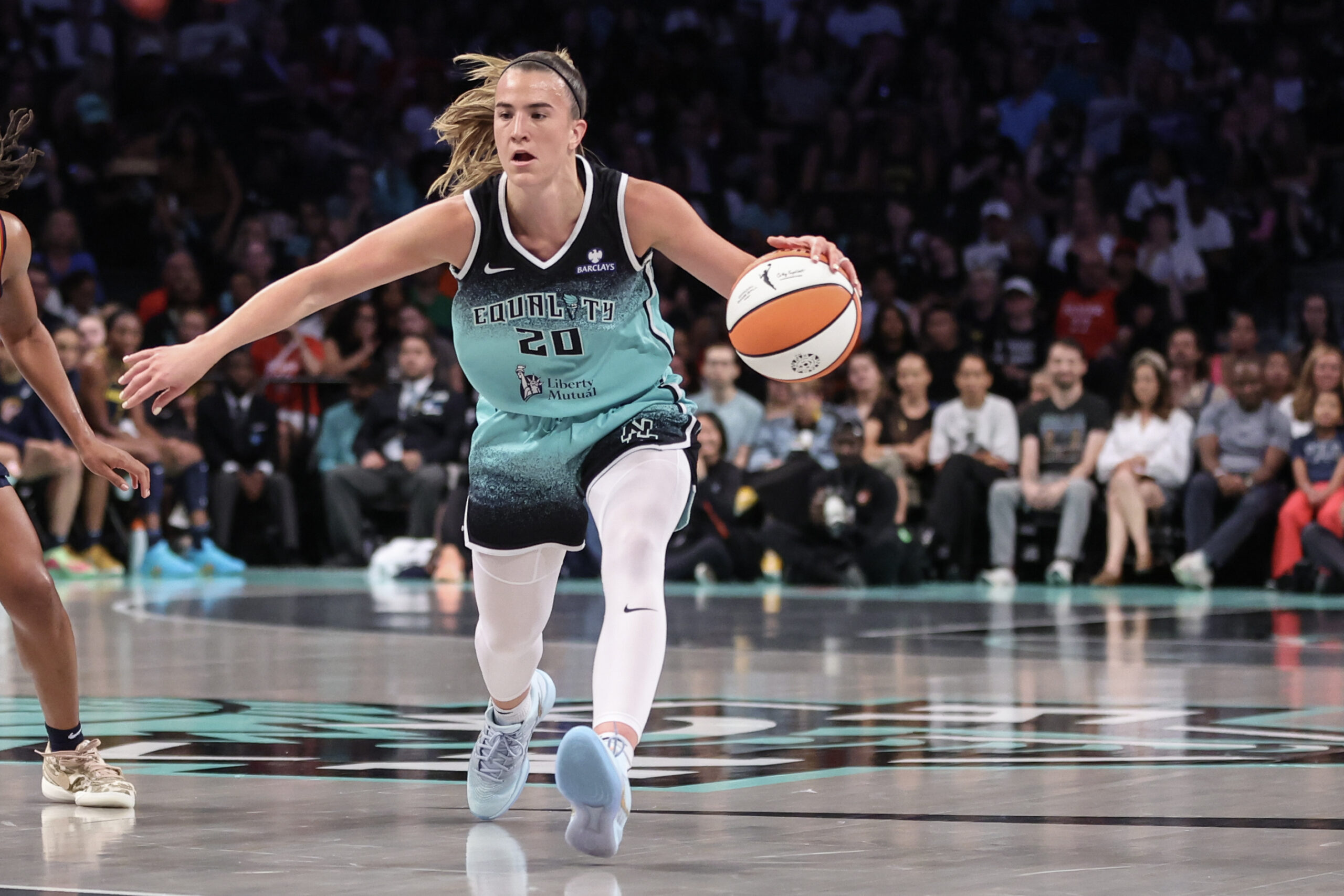 Jul 22, 2025; Brooklyn, New York, USA; New York Liberty guard Sabrina Ionescu (20) brings the ball up court in the first quarter against the Indiana Fever at Barclays Center. Mandatory Credit: Wendell Cruz-Imagn Images
