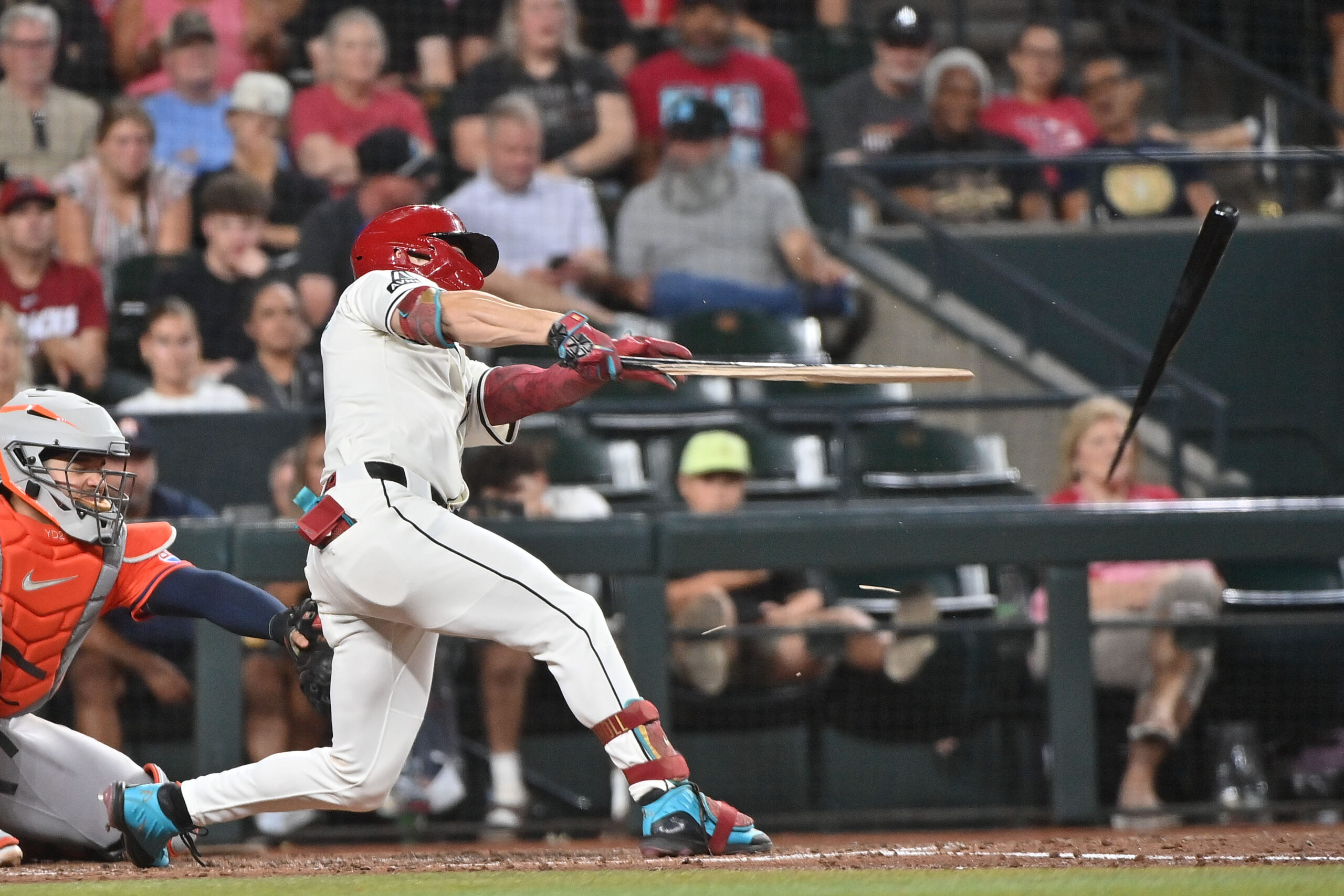 Jul 23, 2025; Phoenix, Arizona, USA;  Arizona Diamondbacks outfielder Corbin Carroll (7) break his bat in the fifth inning against the Houston Astros at Chase Field. Mandatory Credit: Matt Kartozian-Imagn Images