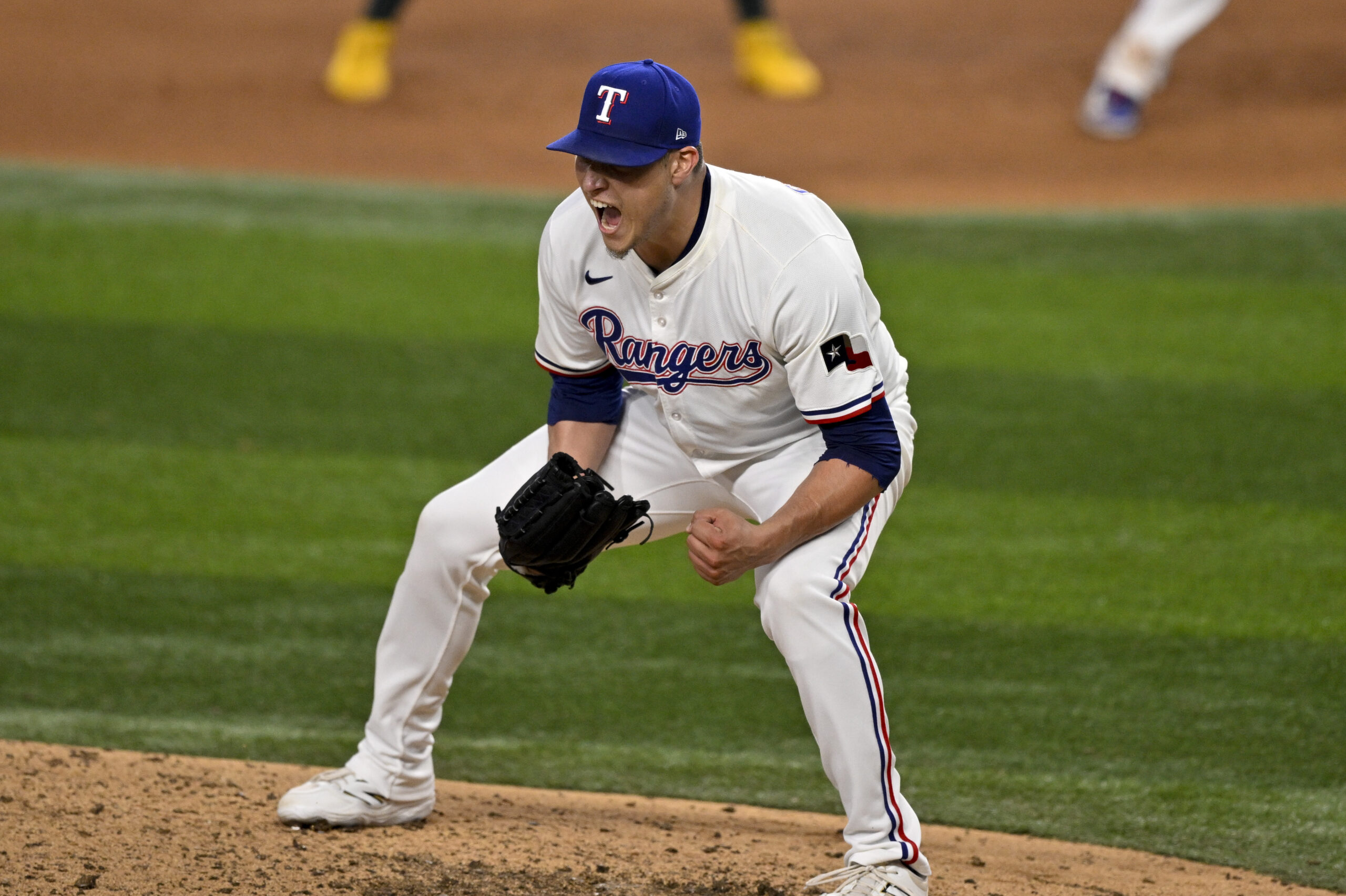 Jul 23, 2025; Arlington, Texas, USA; Texas Rangers relief pitcher Robert Garcia (62) celebrates after he pitches against the Athletics during the ninth inning at Globe Life Field. Mandatory Credit: Jerome Miron-Imagn Images