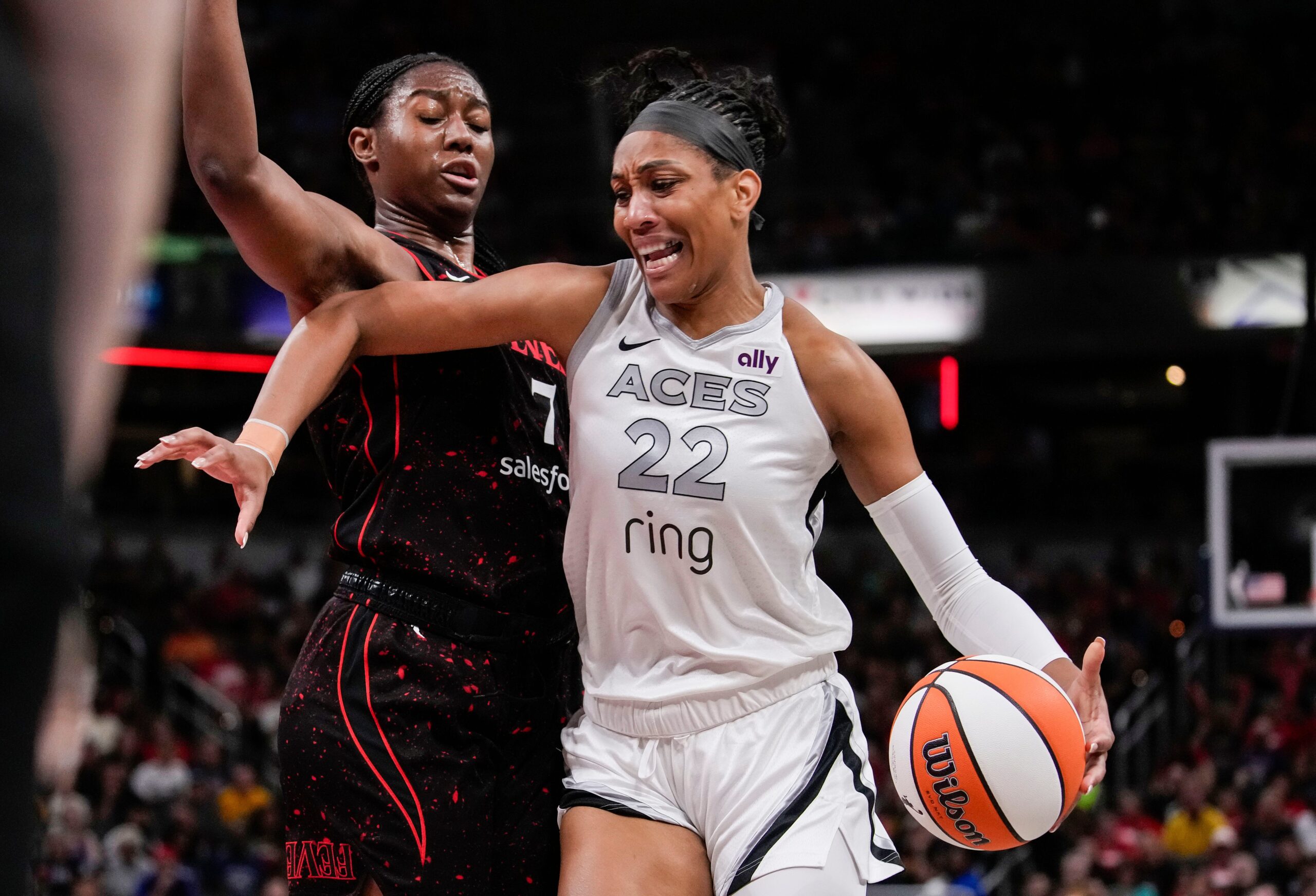 Las Vegas Aces center A'ja Wilson (22) rushes up the court against Indiana Fever forward Aliyah Boston (7) on Thursday, July 24, 2025, during the game at Gainbridge Fieldhouse in Indianapolis.