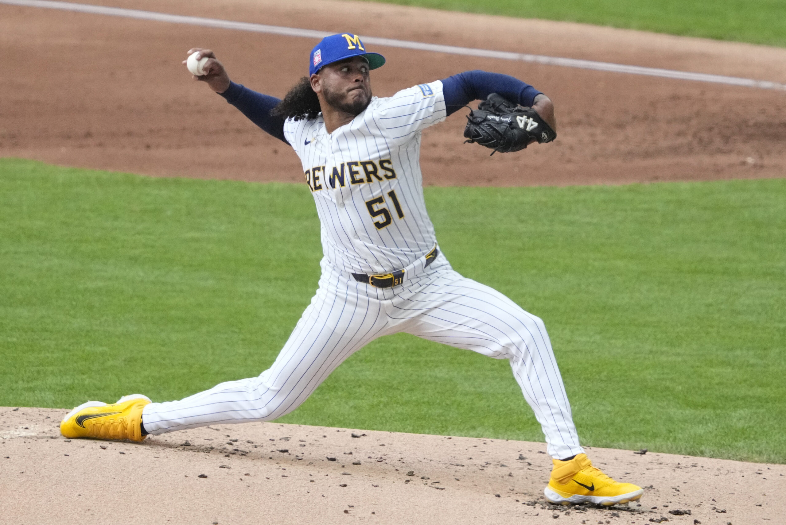 Jul 25, 2025; Milwaukee, Wisconsin, USA; Milwaukee Brewers pitcher Freddy Peralta (51) delivers a pitch against the Miami Marlins in the second inning at American Family Field. Mandatory Credit: Michael McLoone-Imagn Images
