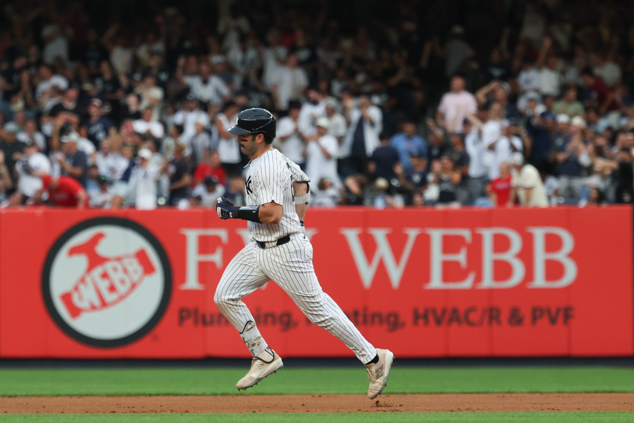 Jul 25, 2025; Bronx, New York, USA; New York Yankees catcher Austin Wells (28) runs the bases after hitting a solo home run during the second inning against the Philadelphia Phillies at Yankee Stadium. Mandatory Credit: Vincent Carchietta-Imagn Images