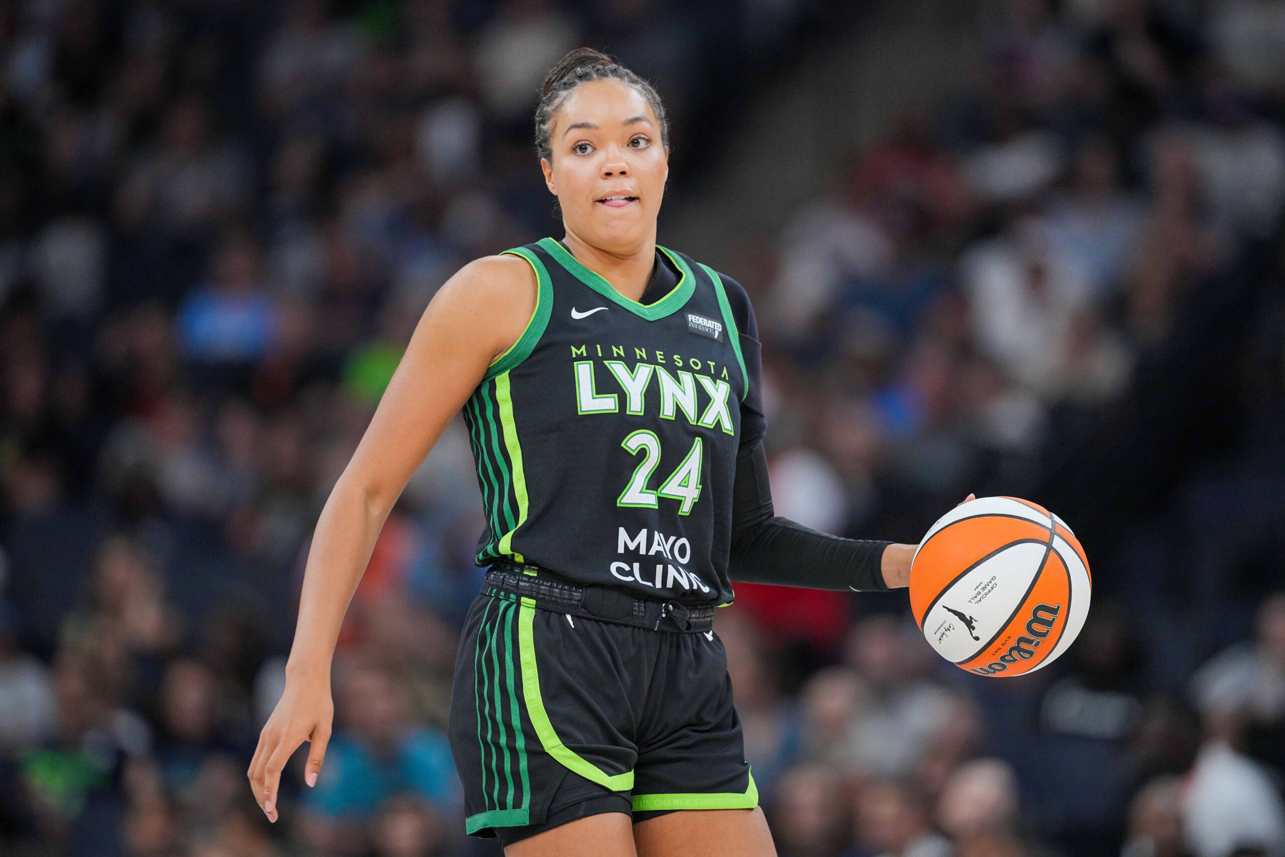 Jul 25, 2025; Minneapolis, Minnesota, USA; Minnesota Lynx forward Napheesa Collier (24) dribbles against the Las Vegas Aces in the third quarter at Target Center. Mandatory Credit: Brad Rempel-Imagn Images
