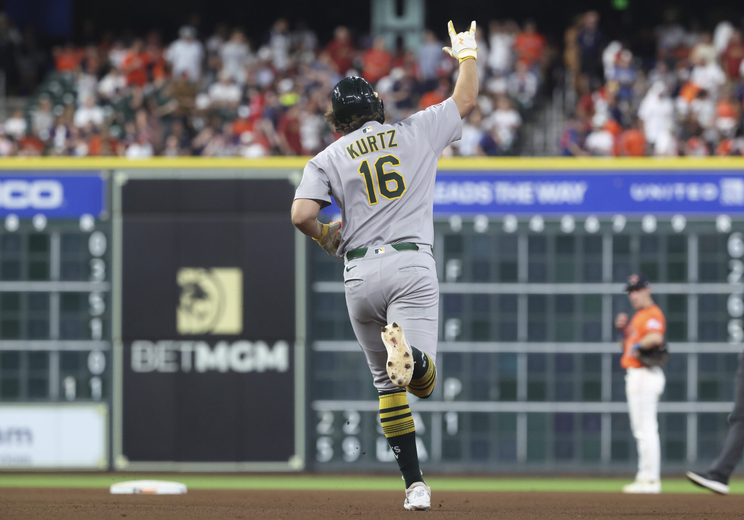 Jul 25, 2025; Houston, Texas, USA;  Athletics designated hitter Nick Kurtz (16) celebrates after hitting a home run during the sixth inning against the Houston Astros at Daikin Park. Mandatory Credit: Troy Taormina-Imagn Images