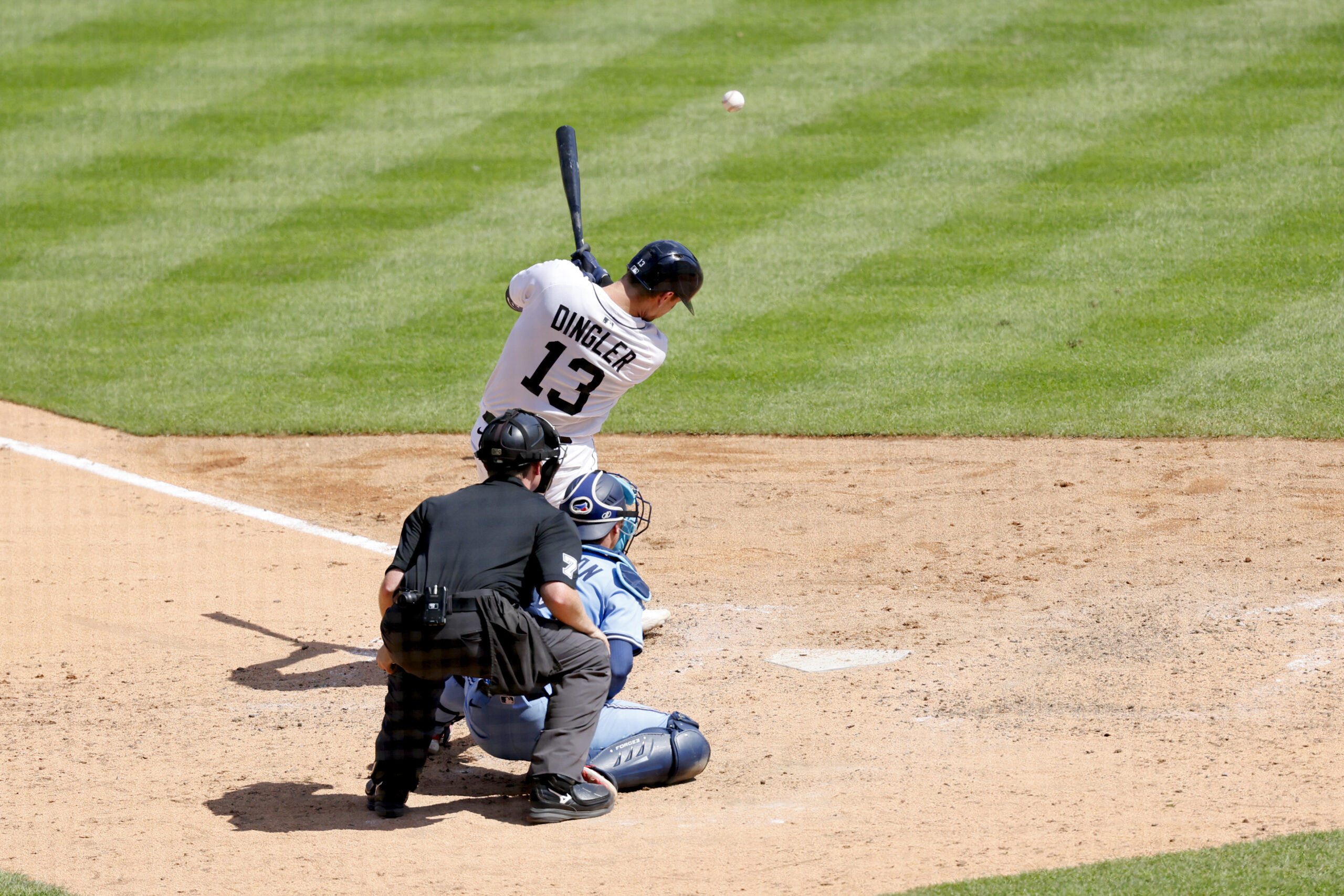 Jul 27, 2025; Detroit, Michigan, USA;  Detroit Tigers catcher Dillon Dingler (13) hits a three RBI single in the eighth inning at Comerica Park. Mandatory Credit: Rick Osentoski-Imagn Images