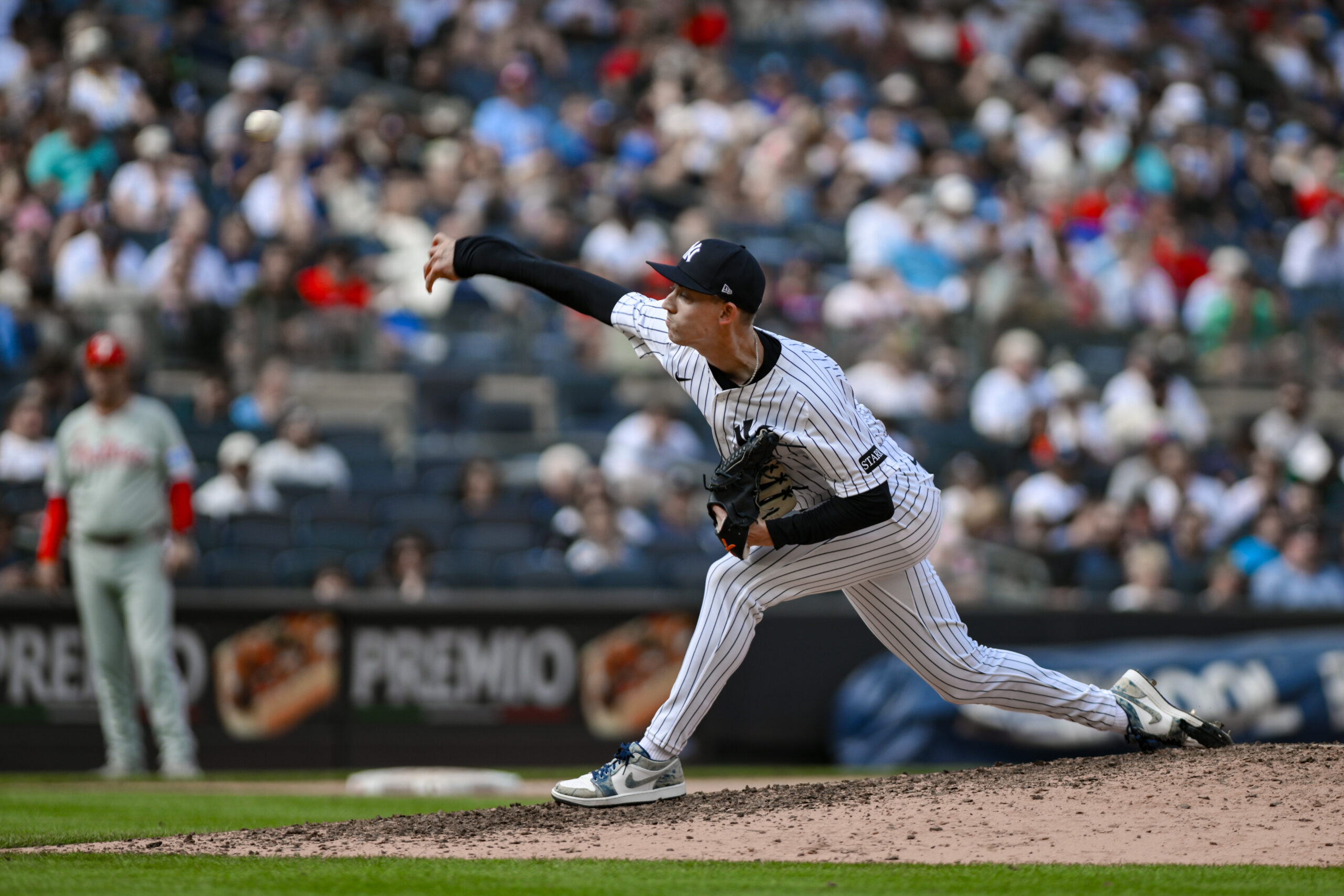 Jul 27, 2025; Bronx, New York, USA; New York Yankees pitcher Luke Weaver (30) pitches against the Philadelphia Phillies during the seventh inning at Yankee Stadium. Mandatory Credit: John Jones-Imagn Images