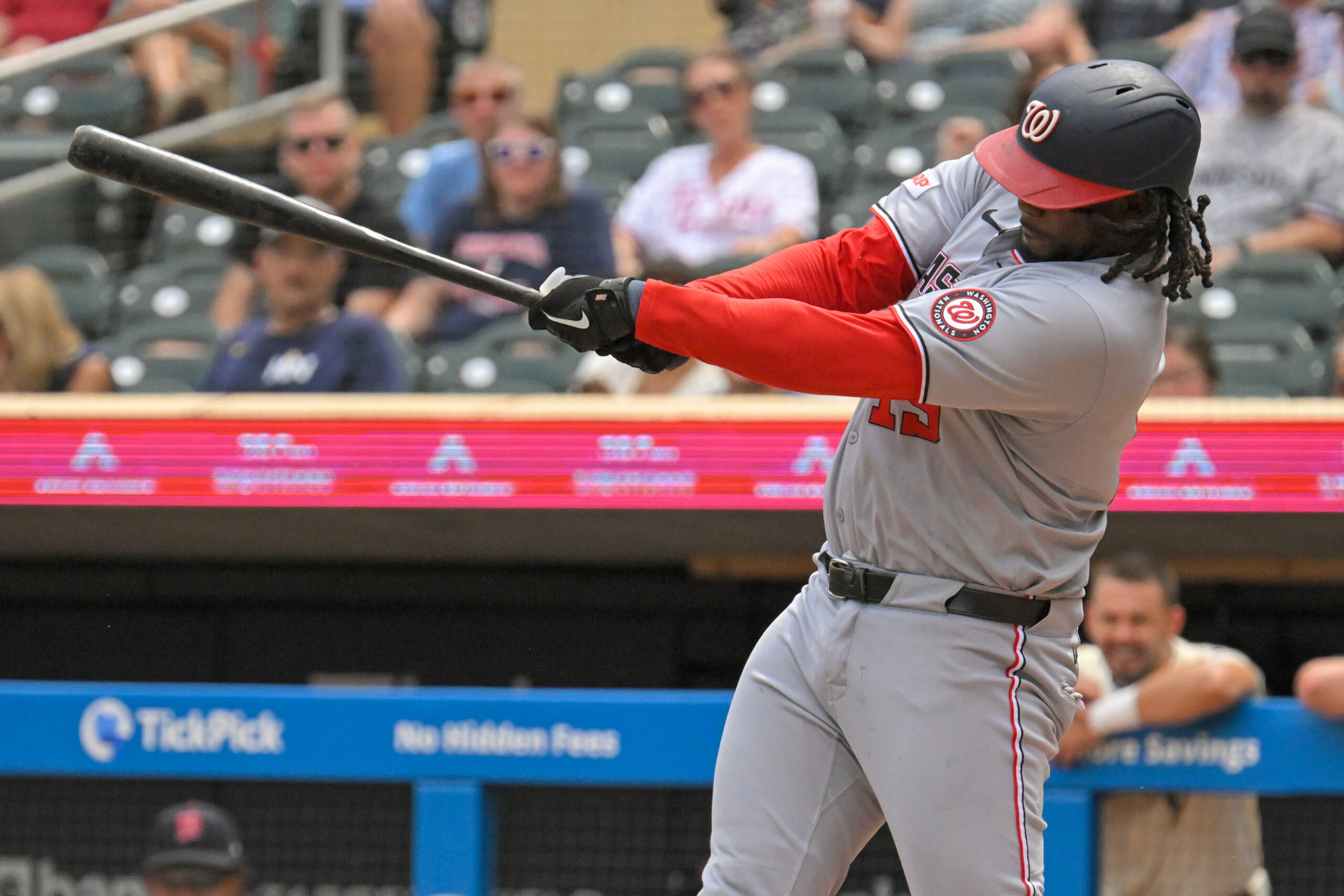 Jul 27, 2025; Minneapolis, Minnesota, USA; Washington Nationals designated hitter Josh Bell (19) hits a single against the Minnesota Twins during the seventh inning at Target Field. Mandatory Credit: Nick Wosika-Imagn Images