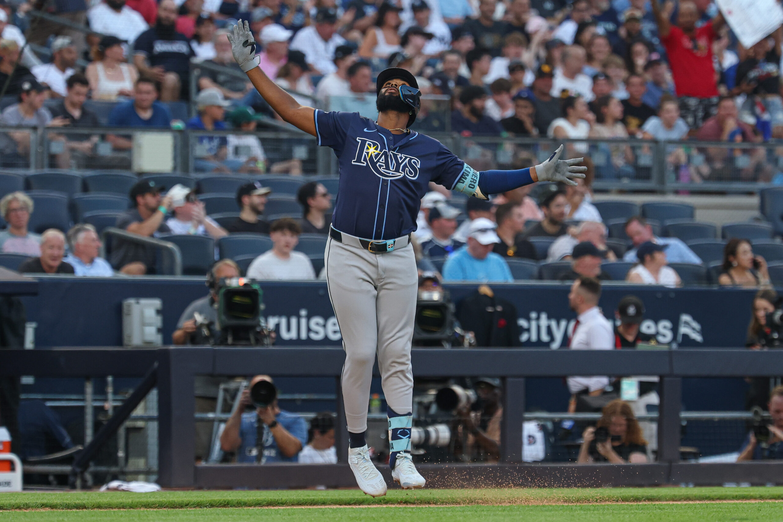 Jul 28, 2025; Bronx, New York, USA;  Tampa Bay Rays third baseman Junior Caminero (13) reacts while running the bases after his two run home run during the first inning against the New York Yankees at Yankee Stadium. Mandatory Credit: Vincent Carchietta-Imagn Images