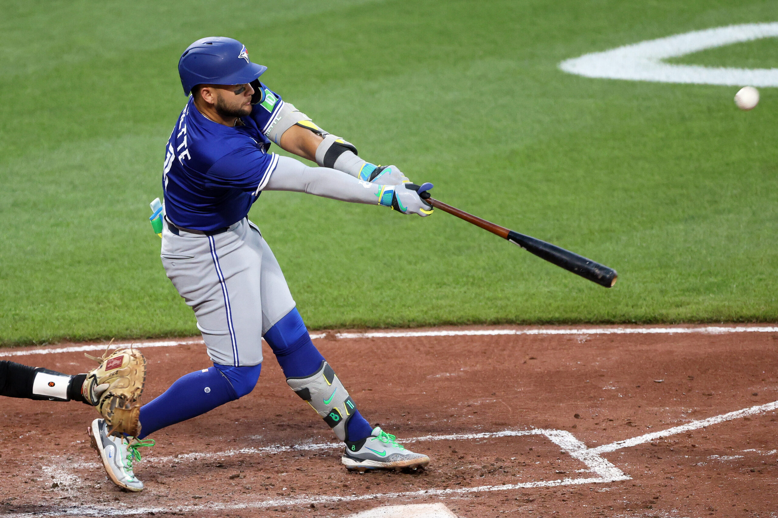 Jul 28, 2025; Baltimore, Maryland, USA; Toronto Blue Jays shortstop Bo Bichette (11) hits a single during the fifth inning against the Baltimore Orioles at Oriole Park at Camden Yards. Mandatory Credit: Daniel Kucin Jr.-Imagn Images