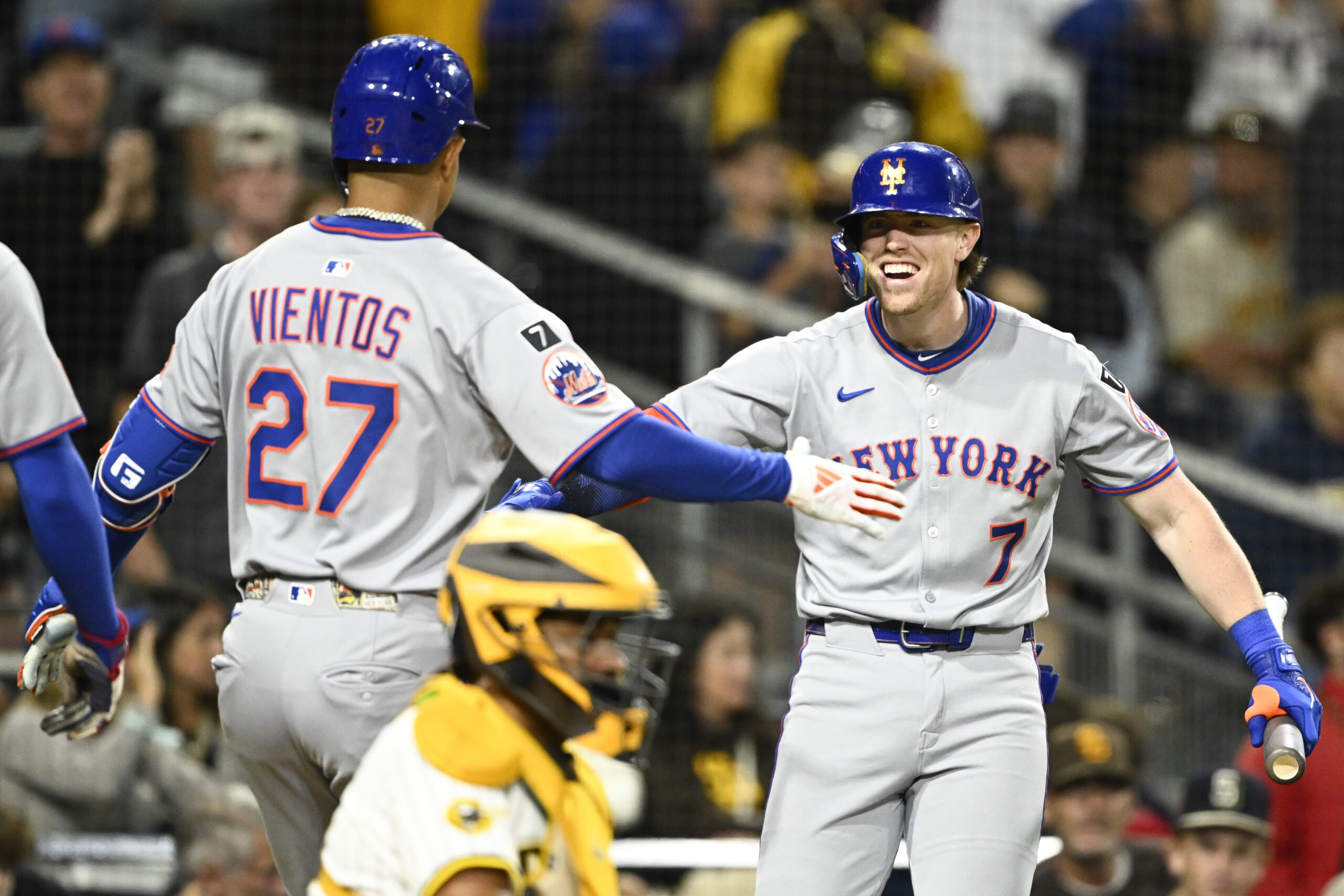 Jul 28, 2025; San Diego, California, USA; New York Mets third baseman Mark Vientos (27) is congratulated by Brett Baty (7) after hitting a grand slam during the fifth inning against the San Diego Padres at Petco Park. Mandatory Credit: Denis Poroy-Imagn Images