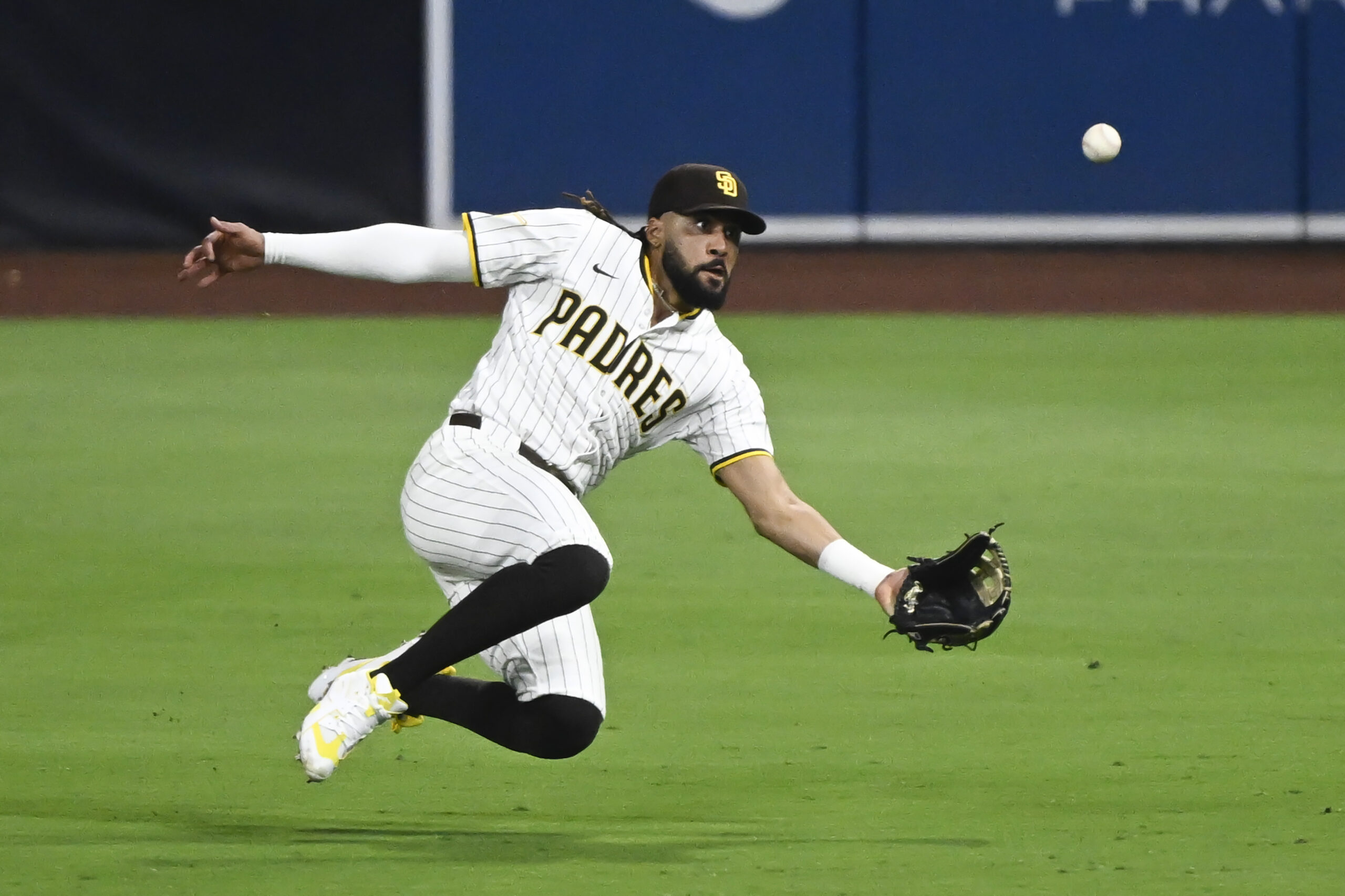 Jul 28, 2025; San Diego, California, USA; San Diego Padres right fielder Fernando Tatis Jr. (23) makes a catch on a ball hit by New York Mets third baseman Ronny Mauricio (10) during the sixth inning at Petco Park. Mandatory Credit: Denis Poroy-Imagn Images
