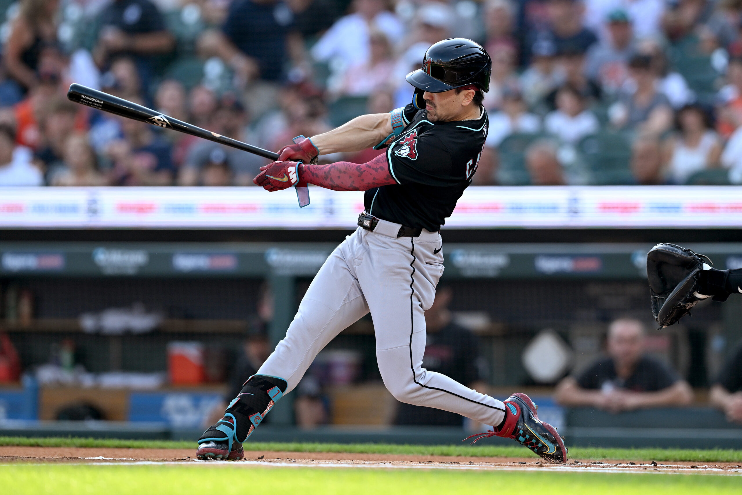 Jul 29, 2025; Detroit, Michigan, USA;  Arizona Diamondbacks right fielder Corbin Carroll (7) hits a leadoff triple against the Detroit Tigers in the first inning at Comerica Park. Mandatory Credit: Lon Horwedel-Imagn Images