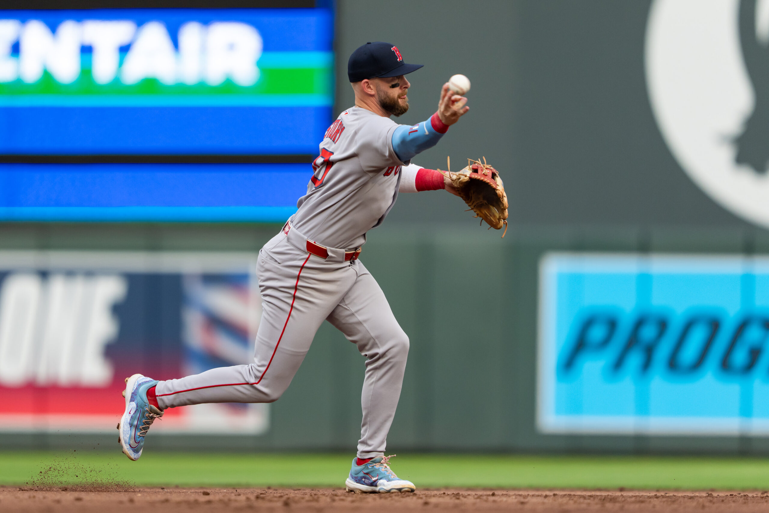 Jul 29, 2025; Minneapolis, Minnesota, USA; Boston Red Sox shortstop Trevor Story (10) throws to first base for the out during the second inning against the Minnesota Twins at Target Field. Mandatory Credit: Jordan Johnson-Imagn Images