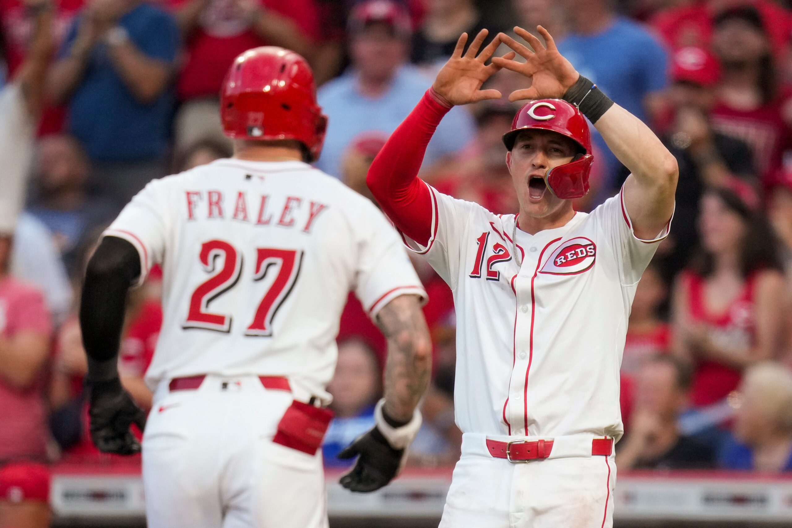 Cincinnati Reds right fielder Jake Fraley (27) crosses the plate on a two-run home run in the fourth inning of the MLB National League game between the Cincinnati Reds and the Los Angeles Dodgers at Great American Ball Park in downtown Cincinnati on Tuesday, July 29, 2025. The Reds led 3-2 after four innings.