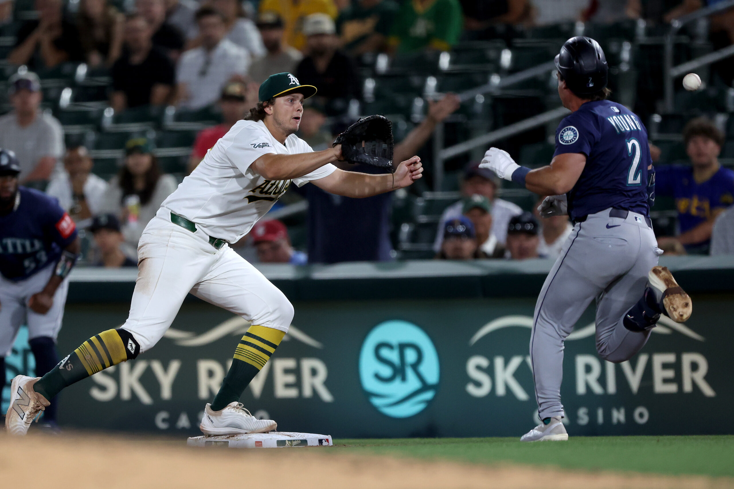 Jul 29, 2025; West Sacramento, California, USA; Athletics first baseman Nick Kurtz (16) catches the ball for a force out against the Seattle Mariners during the ninth inning at Sutter Health Park. Mandatory Credit: Dennis Lee-Imagn Images