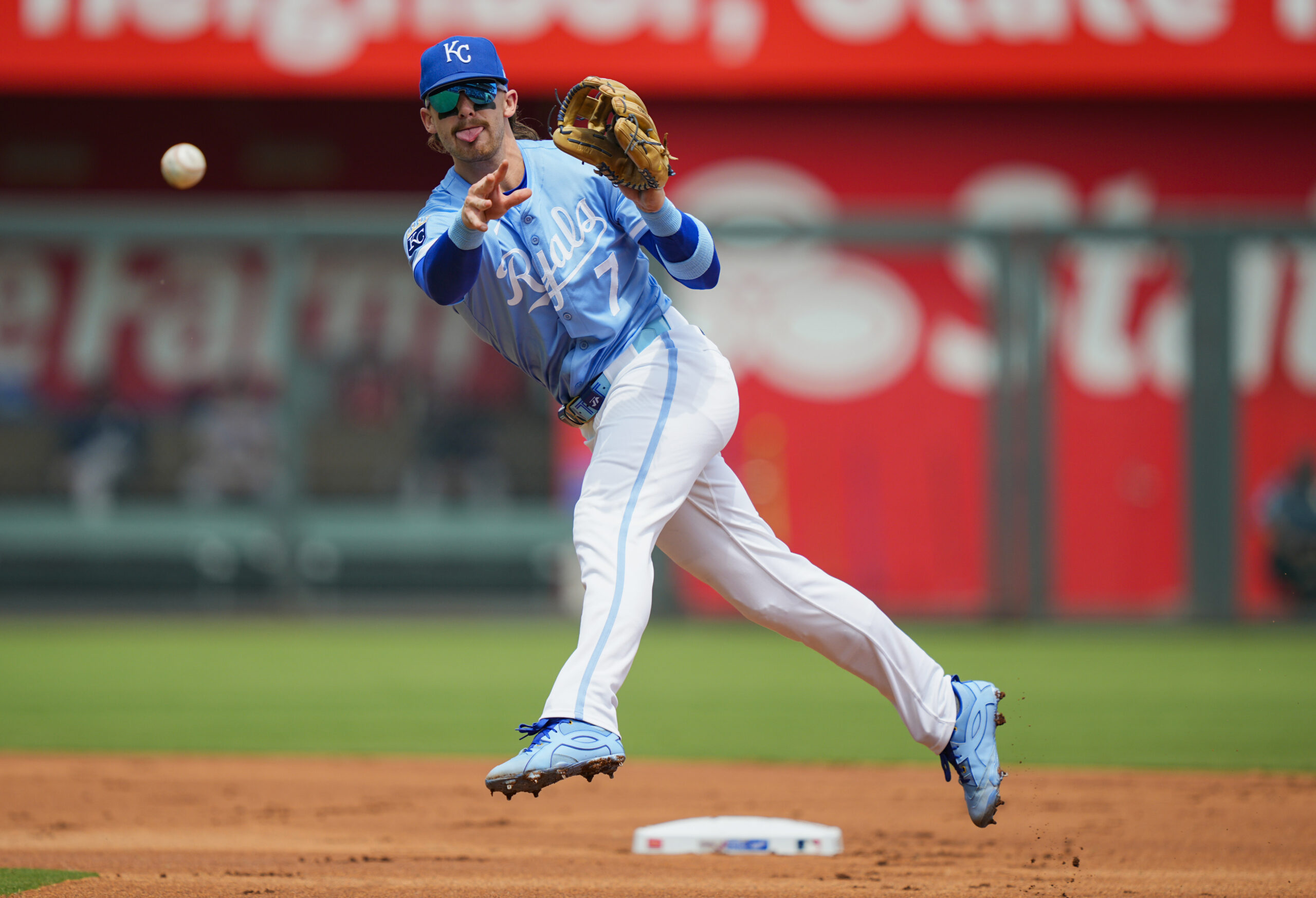 Jul 30, 2025; Kansas City, Missouri, USA; Kansas City Royals shortstop Bobby Witt Jr. (7) throws to first base during the first inning against the Atlanta Braves at Kauffman Stadium. Mandatory Credit: Jay Biggerstaff-Imagn Images