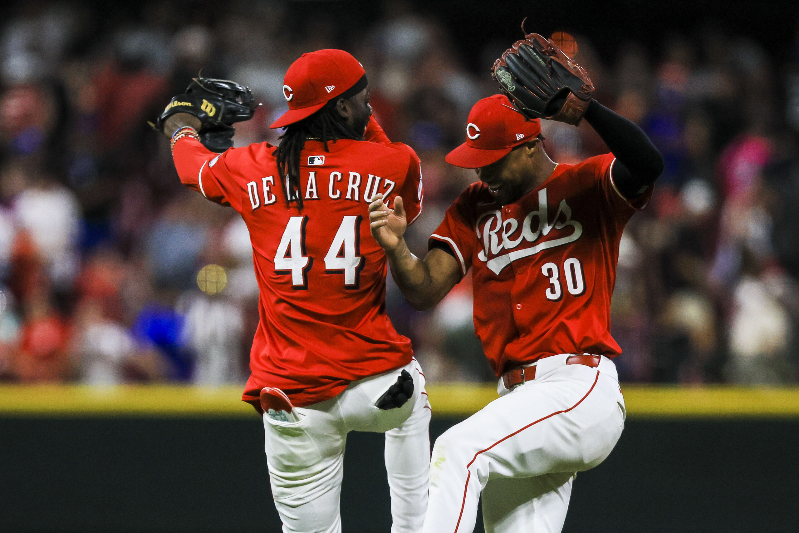 Jul 30, 2025; Cincinnati, Ohio, USA; Cincinnati Reds outfielder Will Benson (30) reacts with shortstop Elly De La Cruz (44) after the victory over the Los Angeles Dodgers at Great American Ball Park. Mandatory Credit: Katie Stratman-Imagn Images