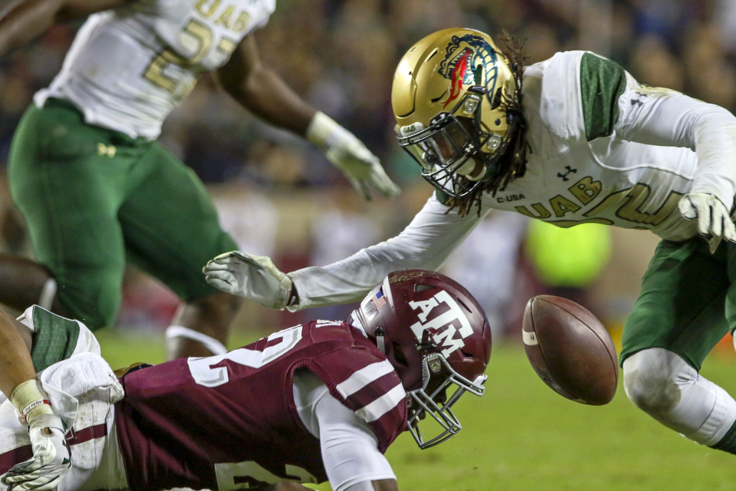 Nov 17, 2018; College Station, TX, USA; Texas A&M Aggies running back Kwame Etwi (22) fumbles the ball during the fourth quarter against the UAB Blazers at Kyle Field. Mandatory Credit: John Glaser-Imagn Images