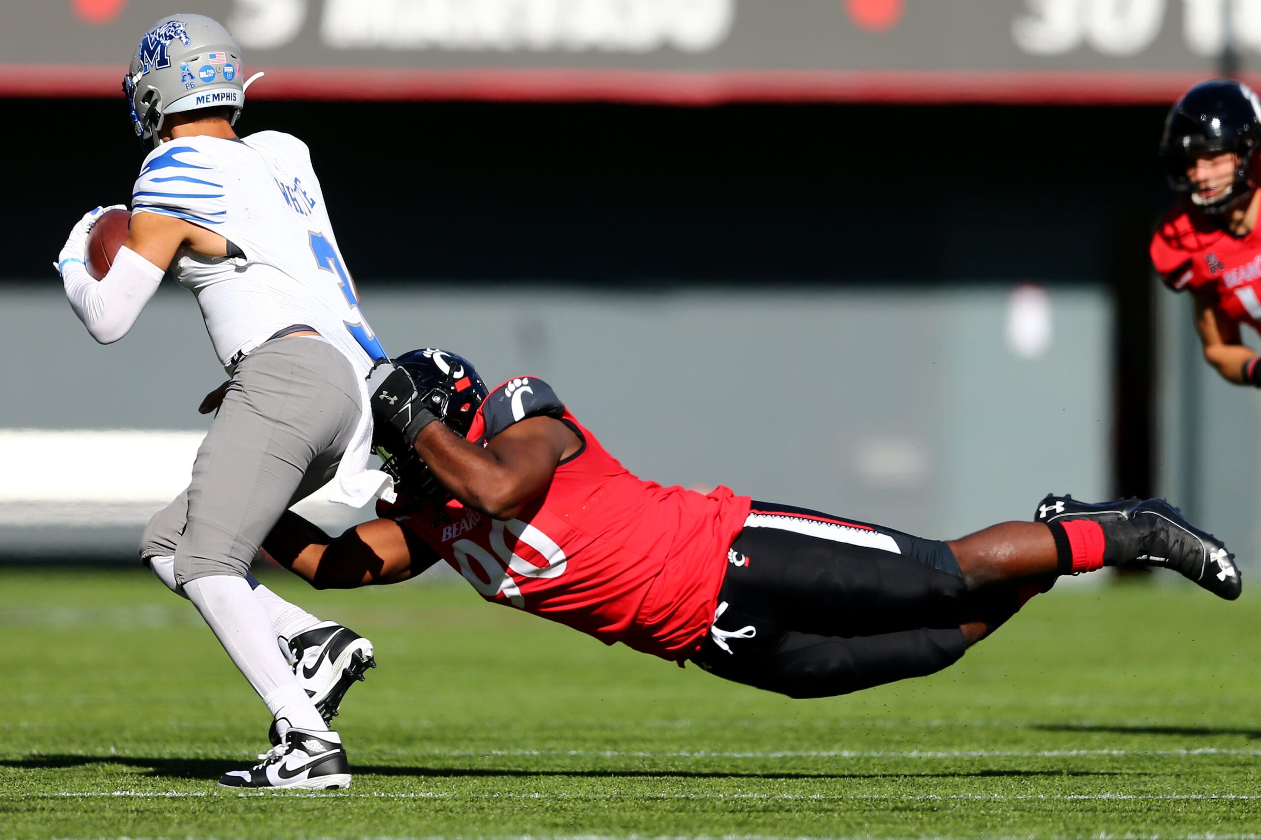 Oct 31, 2020; Cincinnati, OH, USA; Cincinnati Bearcats defensive tackle Jabari Taylor (90) sacks Memphis Tigers quarterback Brady White (3) during the fourth quarter of a college football game, Saturday, Oct. 31, 2020, at Nippert Stadium in Cincinnati. The Cincinnati Bearcats won 49-10. Mandatory Credit: Kareem Elgazzar-USA TODAY NETWORK
Ncaa Football Memphis At Cincinnati